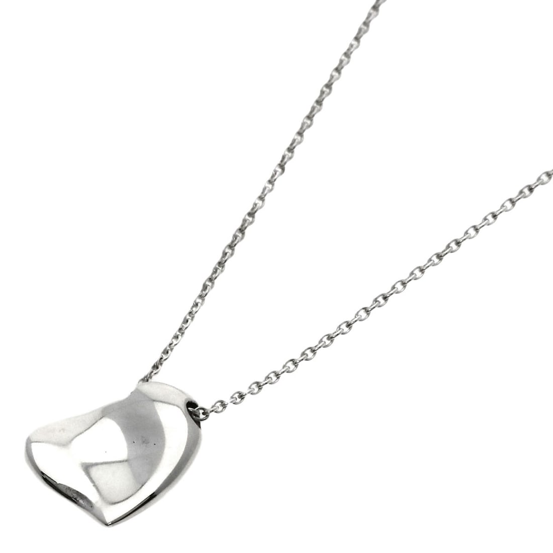 Full heart necklace silver by Tiffany & Co: Full heart necklace silver by Tiffany & Co The Tiffany & Co. Full Heart Necklace in silver is a striking piece, featuring the iconic brand's signature heart design. Made from high-quality silver metal
