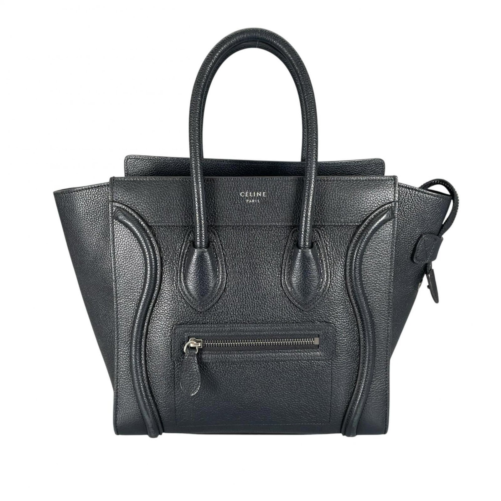 Handbag Leather Celine: Handbag Leather Celine Black leather Celine handbag with silver hardware, measuring 26cm x 42cm x 14cm. This Italian-made bag features high-quality leather construction and sleek design. Its classic s