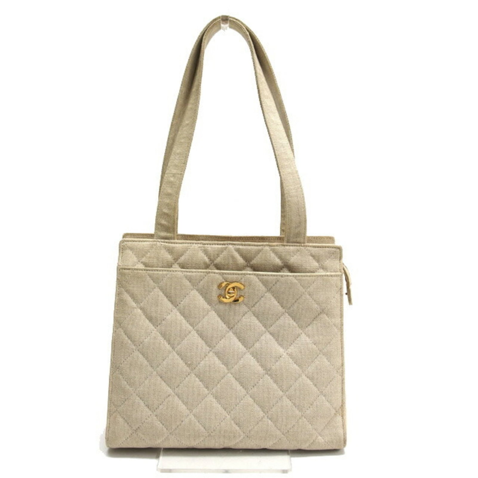 Canvas tote bag by Chanel shoulder: Canvas tote bag by Chanel shoulder Canvas tote bag by Chanel shoulder, featuring an ivory, light beige, or off-white canvas material and open closure. This stylish tote measures 24cm x 26cm x 11cm and