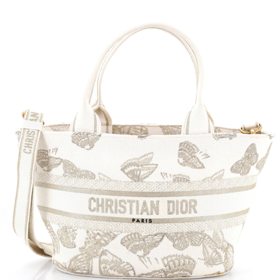 Christian Dior embroidered canvas bag chapeau panier: Christian Dior embroidered canvas bag chapeau panier White canvas embroidered Christian Dior panier chapeau bag with aged gold hardware, featuring scuffs and edge wear on the exterior. The interior re