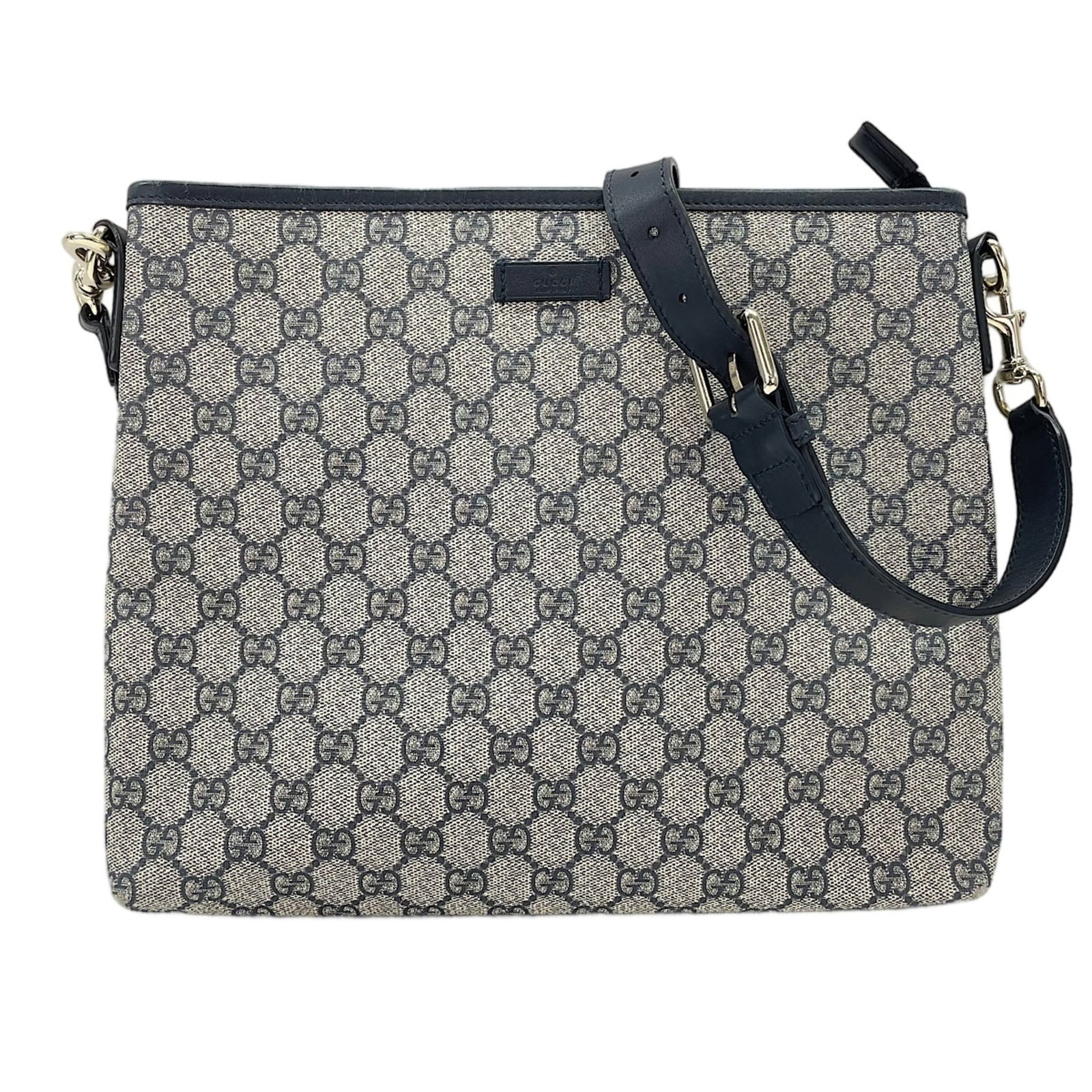 Shoulder Bag by Gucci: Shoulder Bag by Gucci Navy Gucci shoulder bag with clean lines and classic style, measuring 25cm x 30cm x 4.5cm. This Italian-made bag features a timeless design that exudes sophistication and eleganc