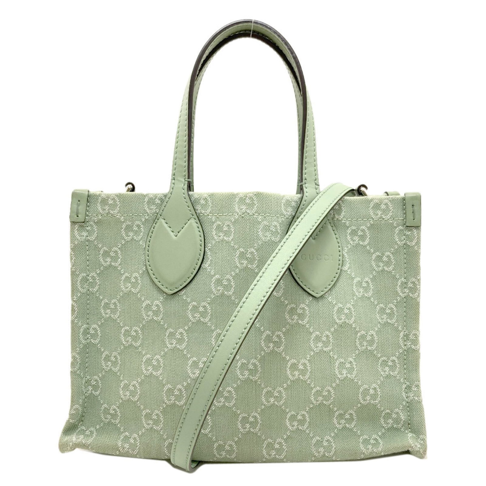 Canvas Handbag Pouch Gucci: Canvas Handbag Pouch Gucci Canvas Handbag Pouch from Gucci, featuring a light green canvas material and measuring 19cm x 27cm x 11.5cm in size. This stylish pouch boasts a classic design with clean li