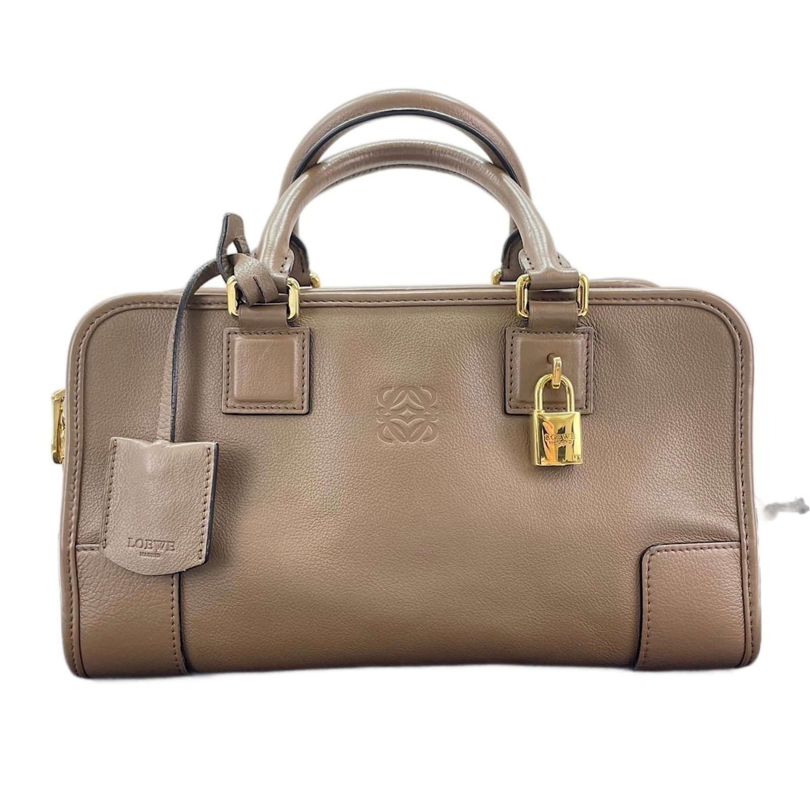 Handbag from Loewe: Handbag from Loewe The Loewe handbag boasts its rich brown color and sleek design, measuring 16cm x 28cm x 13cm. This stylish accessory features a classic silhouette with clean lines and a sturdy buil
