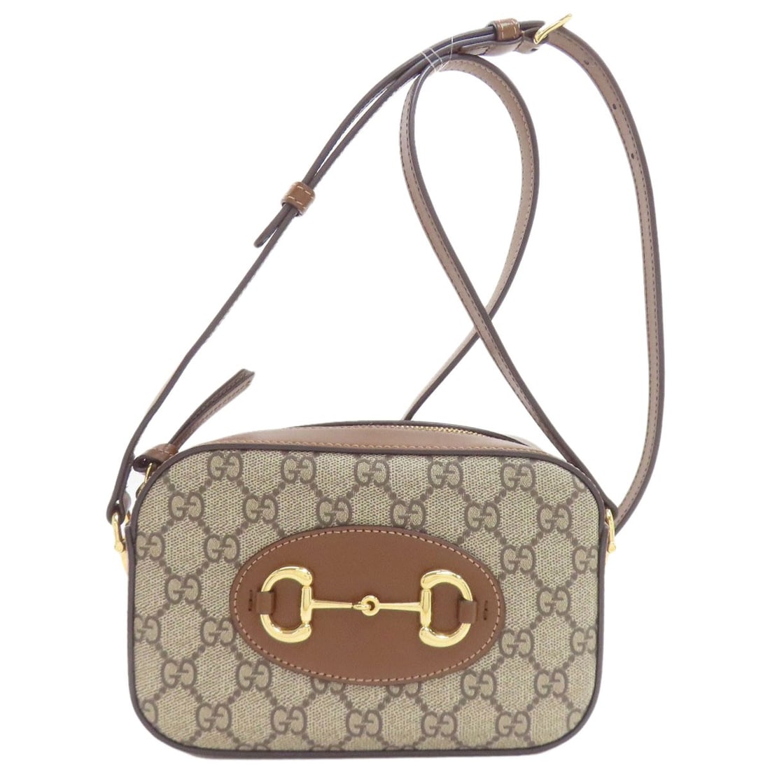 Small Pvc Camera Bag Shoulder Gucci Horsebit 760196: Small Pvc Camera Bag Shoulder Gucci Horsebit 760196 Small PVC camera bag with Gucci Horsebit design, featuring a brown exterior made from PVC material. This shoulder bag showcases the iconic Horsebit