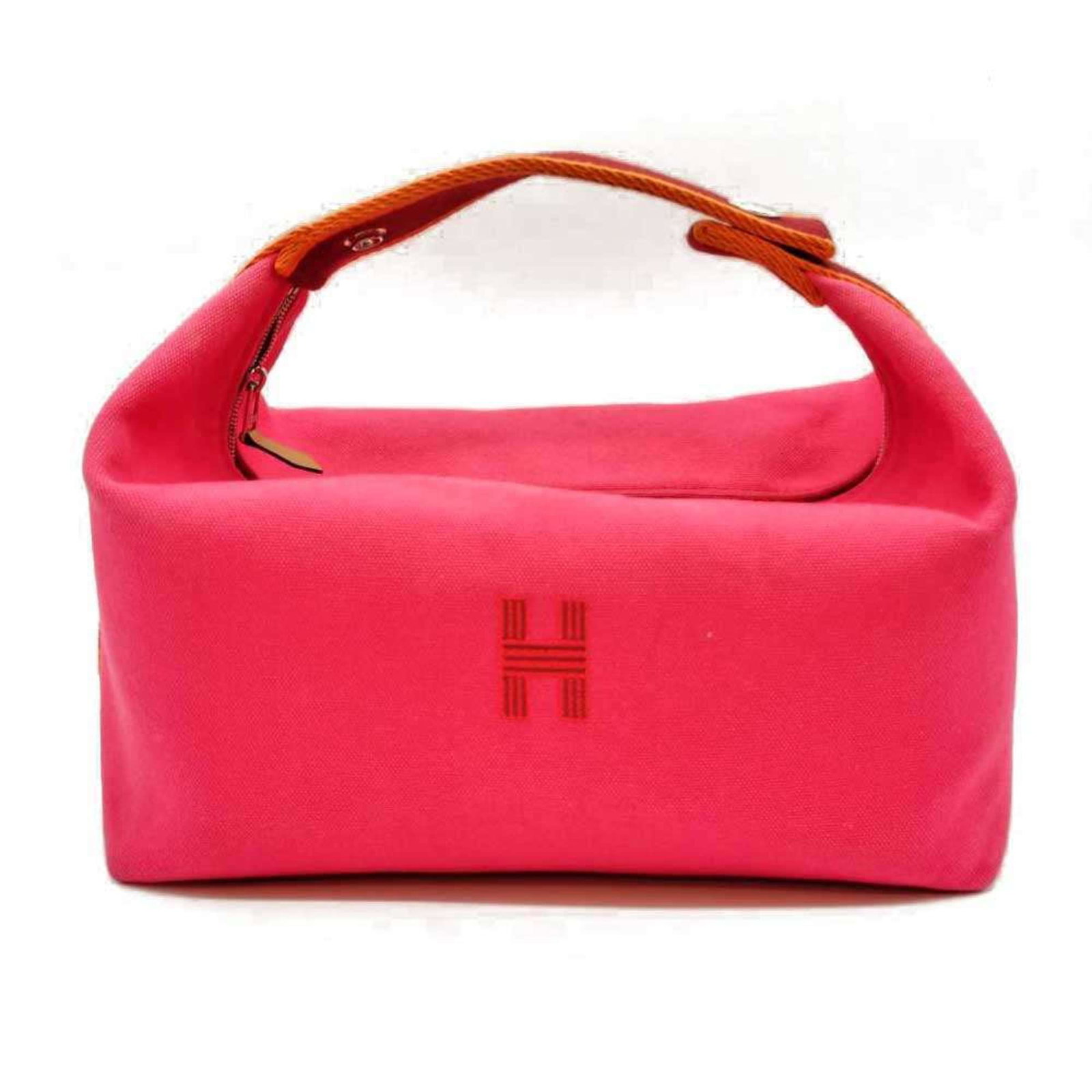Handbag Canvas by Hermes: Handbag Canvas by Hermes Canvas by Hermes, a vibrant pink handbag made from canvas material, features a zipper closure and measures 12cm x 25cm x 15cm. The bag's compact size makes it easy to carry, w