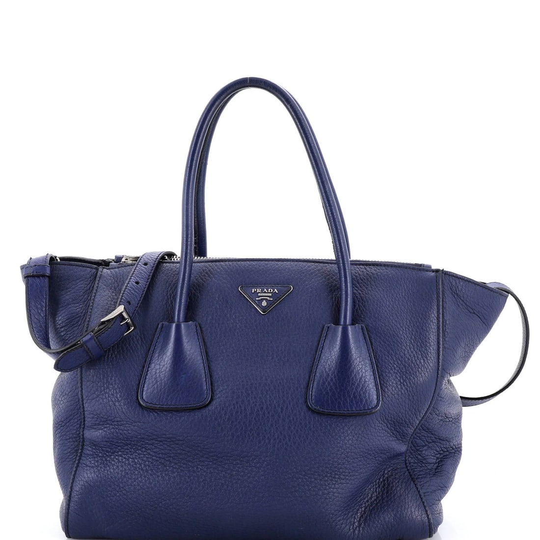 Pocket leather large twin Prada: Pocket leather large twin Prada Large Twin Pocket Leather Prada Tote in Blue. This spacious tote boasts two large pockets and features a sturdy poignet luggage tag with strap, perfect for hands-free