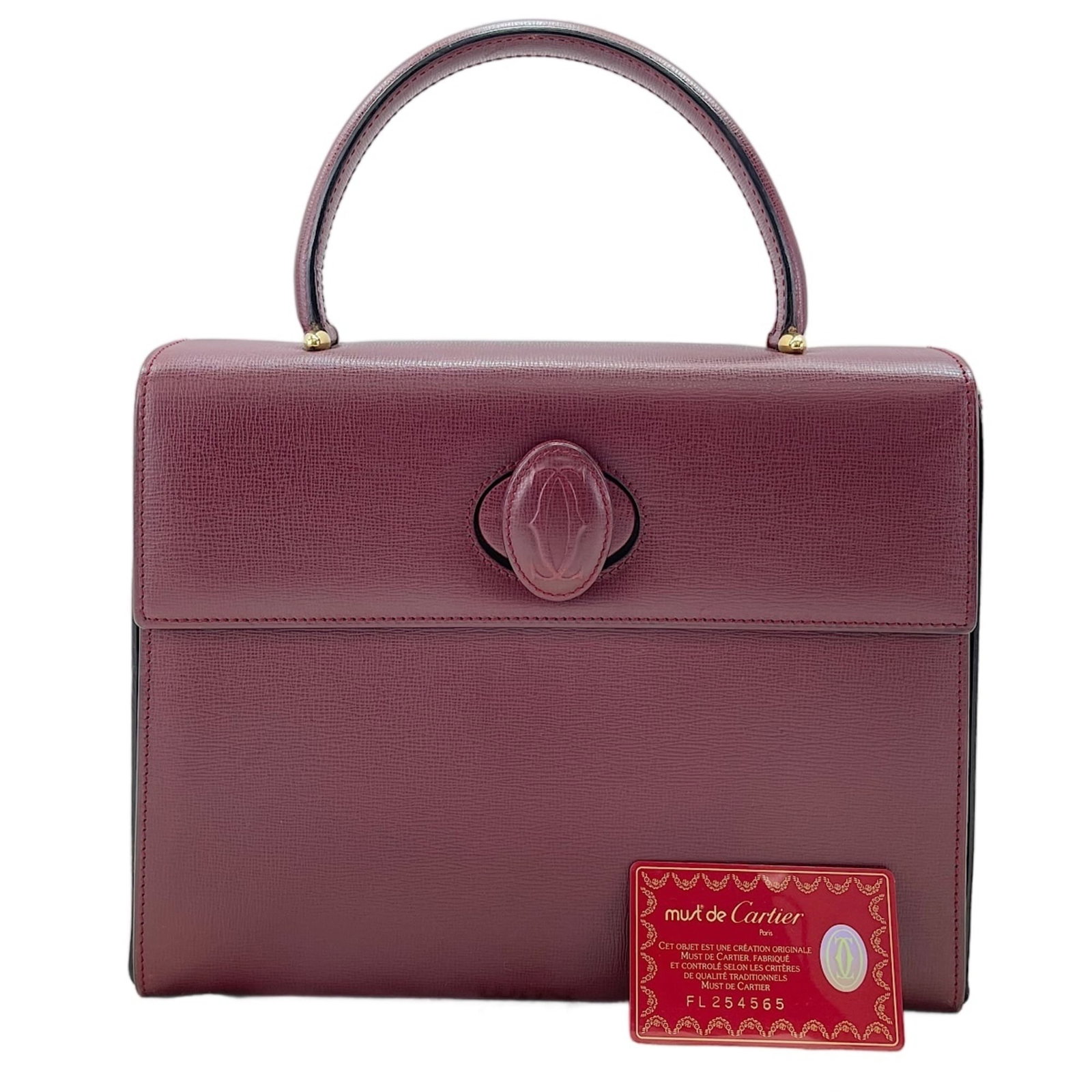 Handbag Cartier: Handbag Cartier Cartier's wine red handbag boasts elegant proportions, measuring 22cm x 28cm x 8.5cm, with a sleek design that complements its rich color palette. The bag's compact size makes it perfe