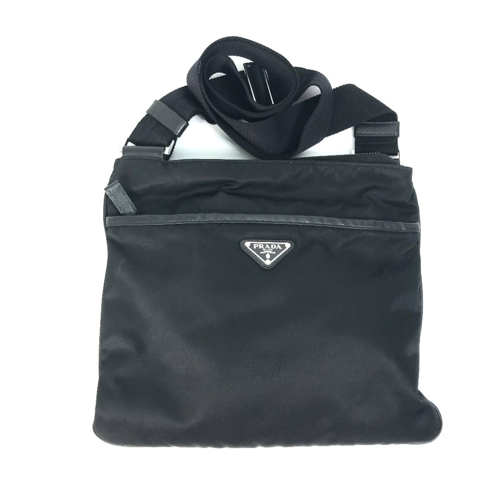 Shoulder Bag by Other: Shoulder Bag by Other Black shoulder bag by Prada, measuring 29cm x 26cm (11.4" x 10.2") in size. The bag features a distinctive design with the signature printed on it. Made from other materials,