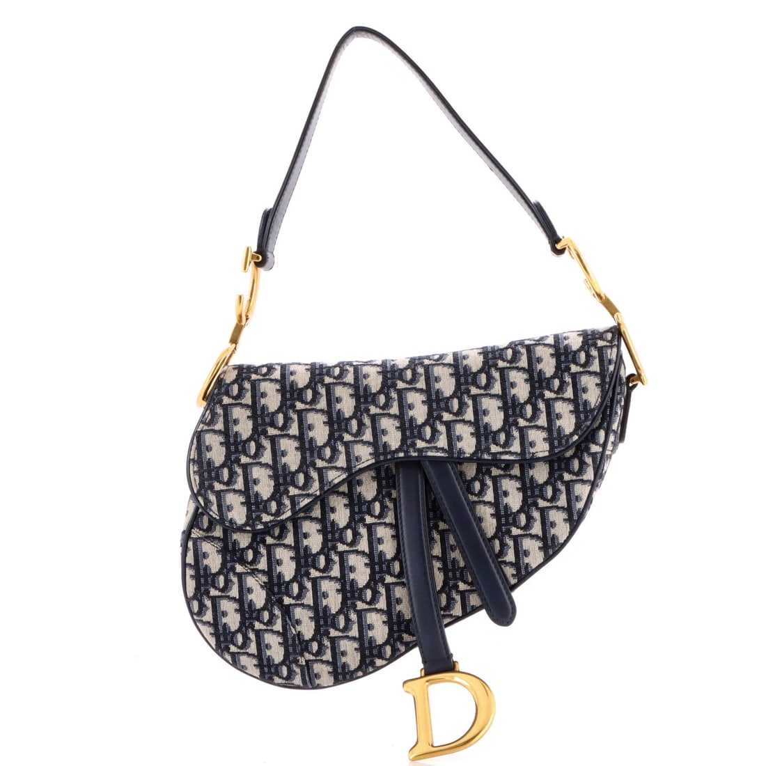 Canvas handbag saddle oblique medium Christian Dior: Canvas handbag saddle oblique medium Christian Dior Canvas handbag saddle oblique medium Christian Dior features a striking blue canvas exterior with minor creases and discoloration. The interior boas