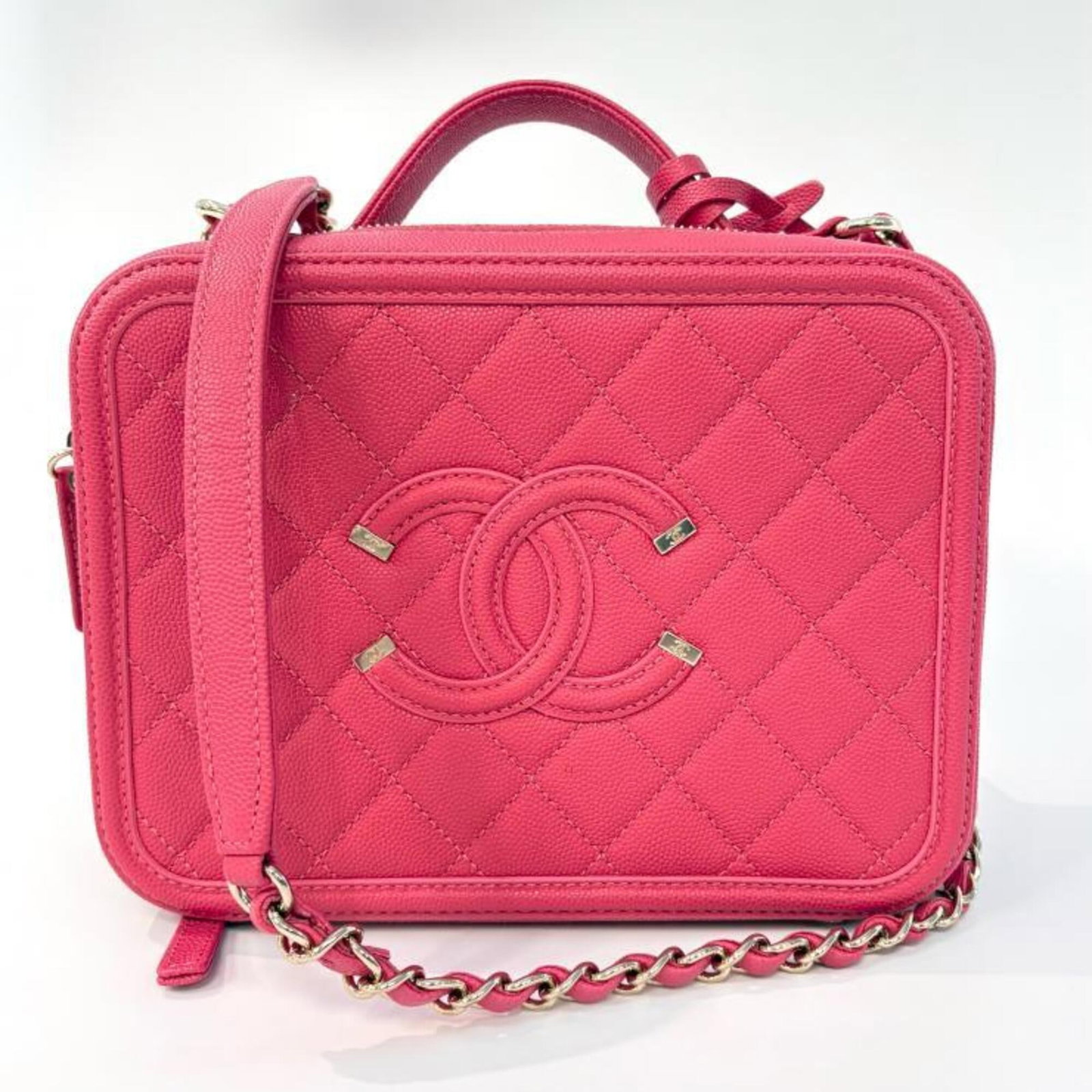 Calfskin Shoulder Bag by Chanel: Calfskin Shoulder Bag by Chanel Pink Grained Calfskin Shoulder Bag by Chanel, measuring 16cm x 21cm x 8cm. This stylish bag features a classic design with a signature Chanel touch. Made from