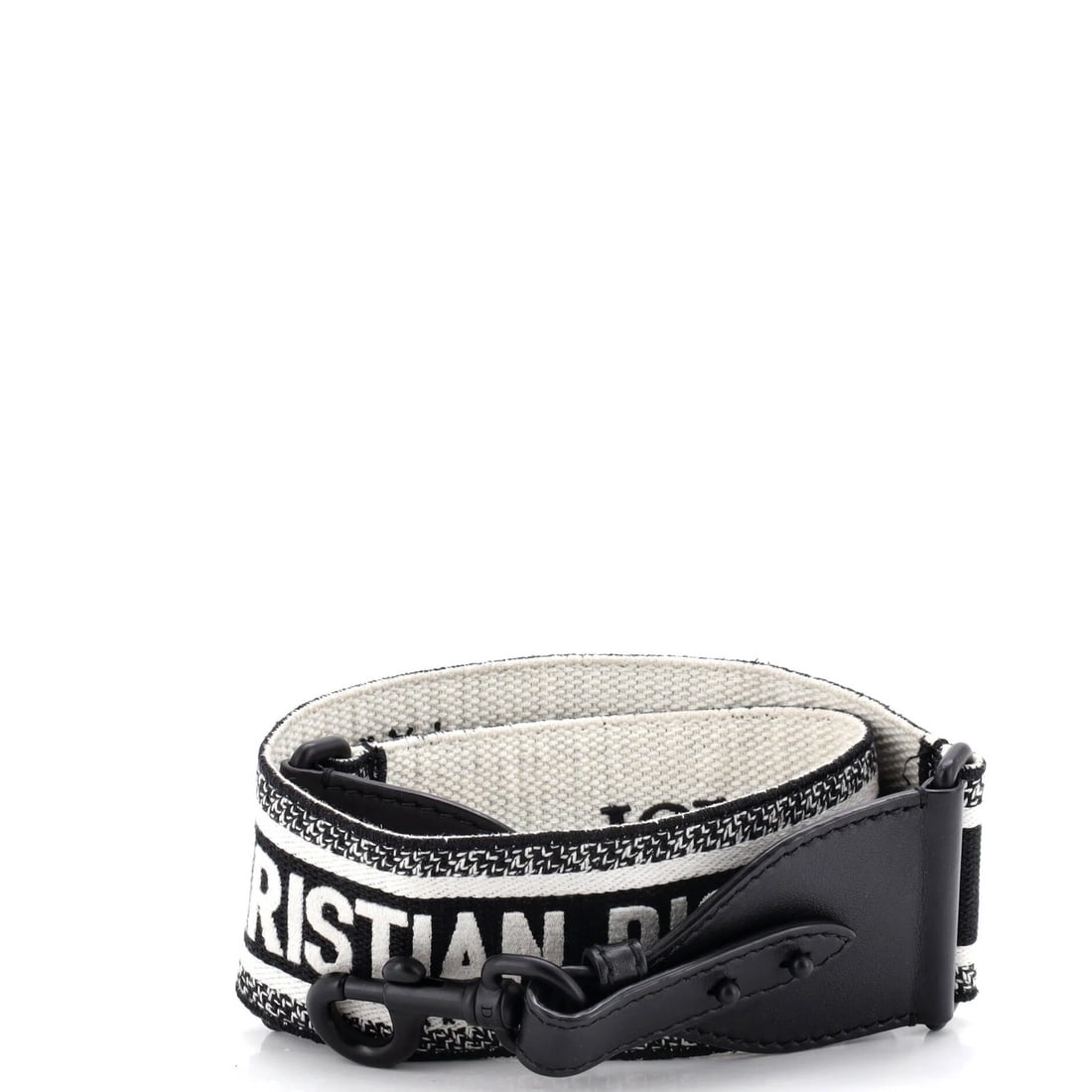 Shoulder strap canvas embroidered by Dior Christian: Shoulder strap canvas embroidered by Dior Christian This Dior Christian shoulder strap canvas features intricate embroidery on a black canvas exterior, with white interior accents. The piece measures 