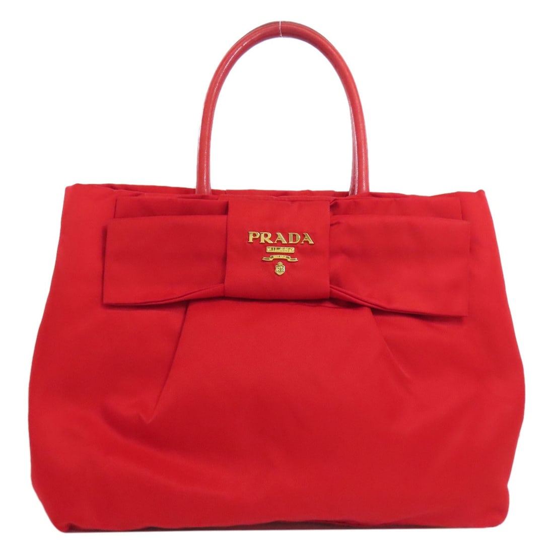 Handbag Nylon Prada Fiocco: Handbag Nylon Prada Fiocco Red PRADA Fiocco Handbag made from Nylon. This handbag features the iconic red color and nylon material, characteristic of the PRADA Fiocco style. The bold design makes a st