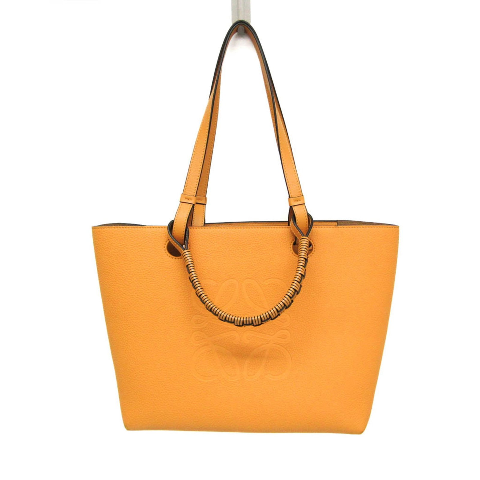 Handbag tote bag leather from Loewe: Handbag tote bag leather from Loewe Saffron yellow Loewe Anagram Tote bag made from high-quality calfskin leather. This stylish tote features a classic design with clean lines and a timeless look,
