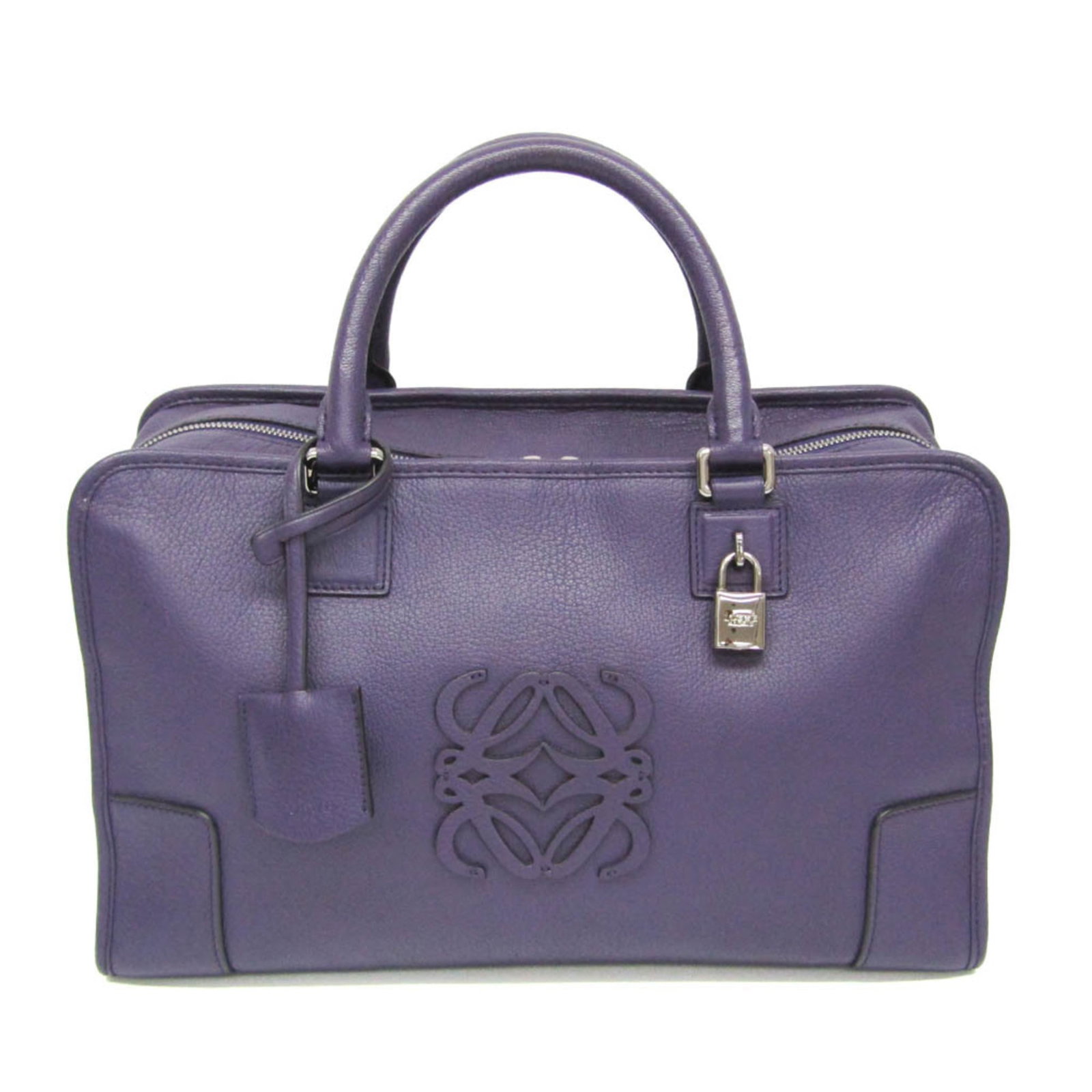 Handbag Leather from Loewe: Handbag Leather from Loewe Handbag from Loewe's Amazona line, crafted in rich purple leather with silver hardware and featuring two functional zipper pockets for added convenience. Measuring 22cm x 36