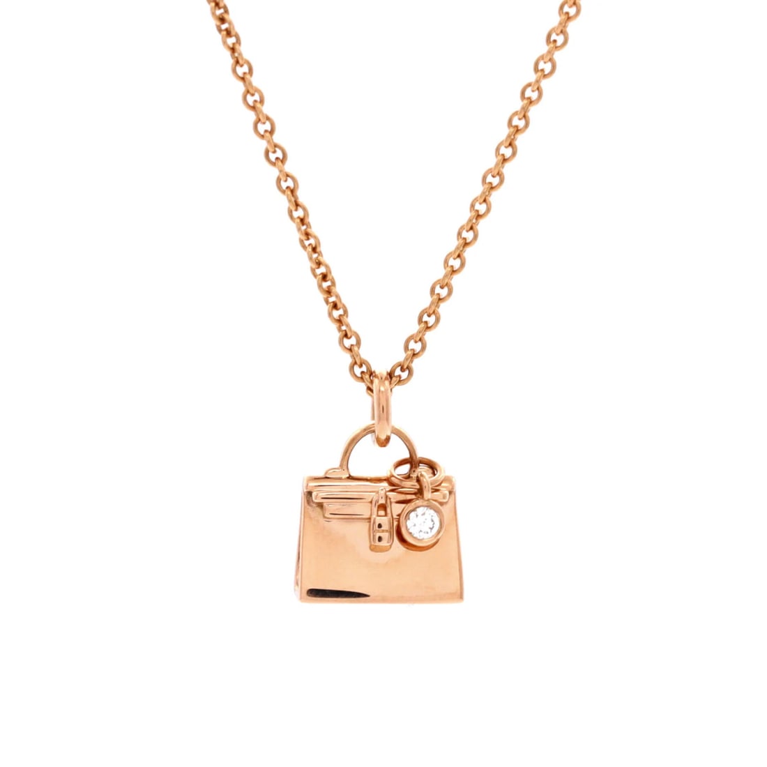 Hermes Amulettes Kelly Pendant NM Necklace 18K Rose Gold with Diamond: Hermes Amulettes Kelly Pendant NM Necklace 18K Rose Gold with Diamond 18K Rose Gold Amulettes Kelly Pendant Necklace with Diamond, featuring a stunning 11.95mm pendant suspended from a 15.0-15.75" cha
