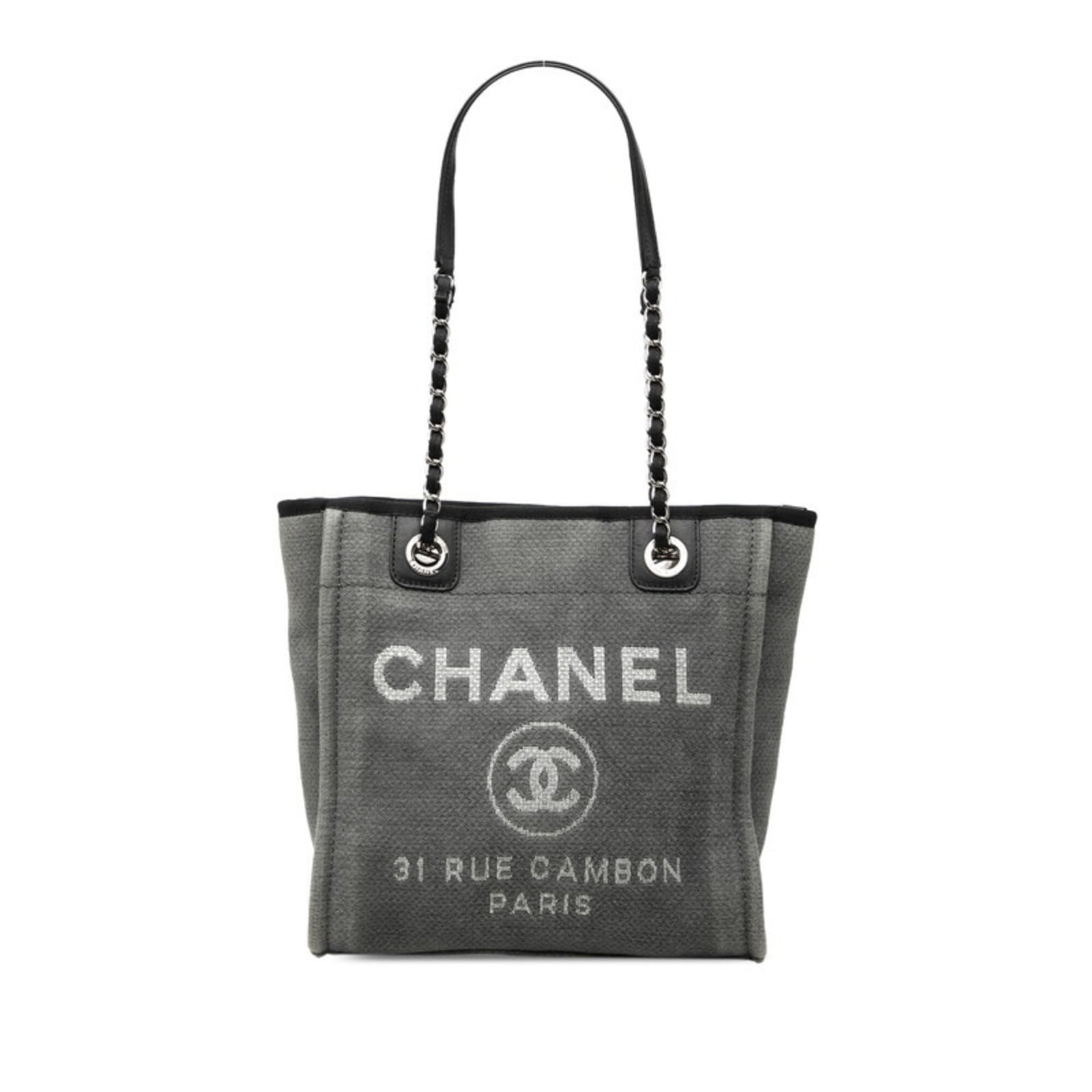 Canvas leather tote bag shoulder bag by Chanel: Canvas leather tote bag shoulder bag by Chanel Canvas leather tote bag by Chanel, available in black and gray. This shoulder bag features canvas and leather construction, with a size of 26cm x 26cm x