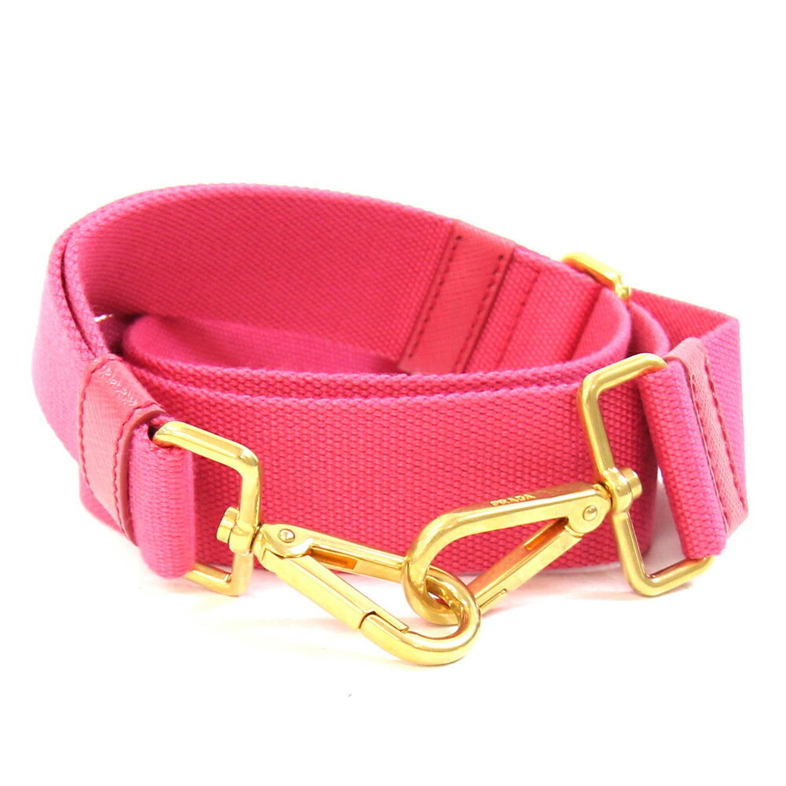 Canvas strap by Prada: Canvas strap by Prada Canvas strap by Prada, made from high-quality canvas in a vibrant pink color. This stylish accessory bears a signature and adds a touch of elegance to any outfit. A unique and ey