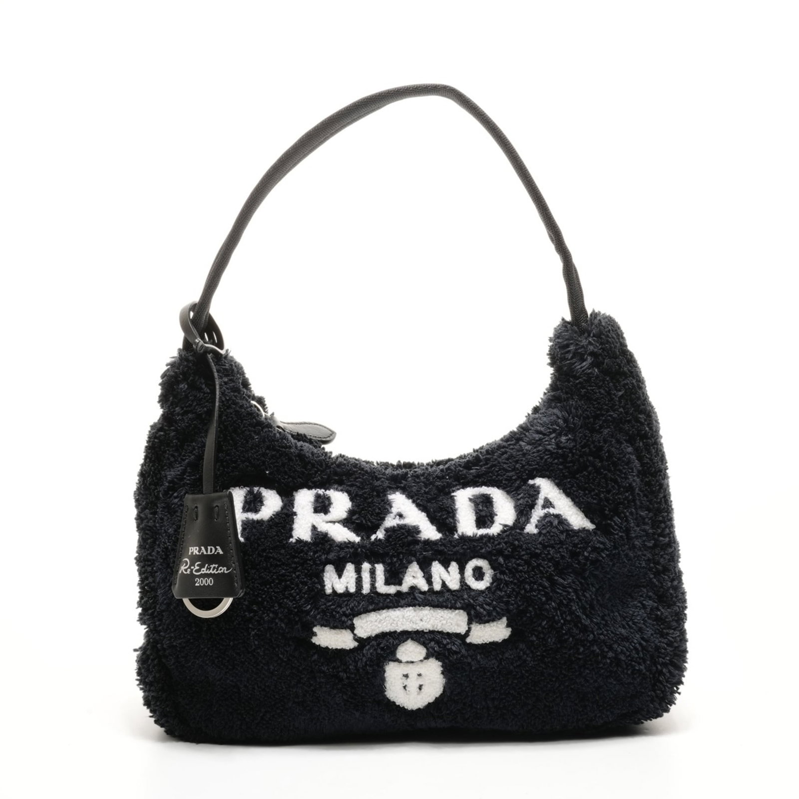 Handbag from Prada: Handbag from Prada Prada's sleek black handbag boasts a compact size, measuring 18cm x 22cm x 6cm, making it the perfect accessory for everyday use. The bag's dimensions are accompanied by a sturdy bu