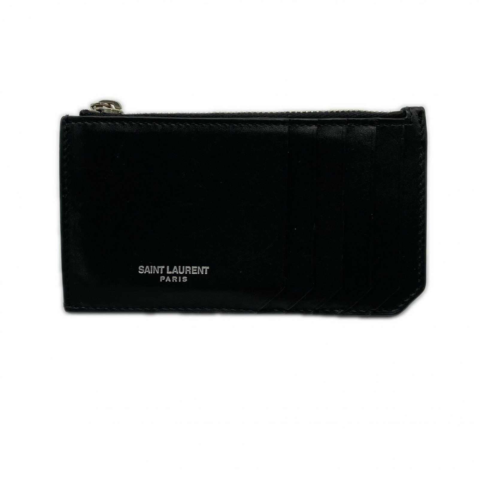 Yves Saint Laurent Coin Purse/ Coin Case Leather: Yves Saint Laurent Coin Purse/ Coin Case Leather Black Calfskin Yves Saint Laurent Coin Purse with Zipper Closure. Made from high-quality leather, this coin purse features a sleek design and durable c