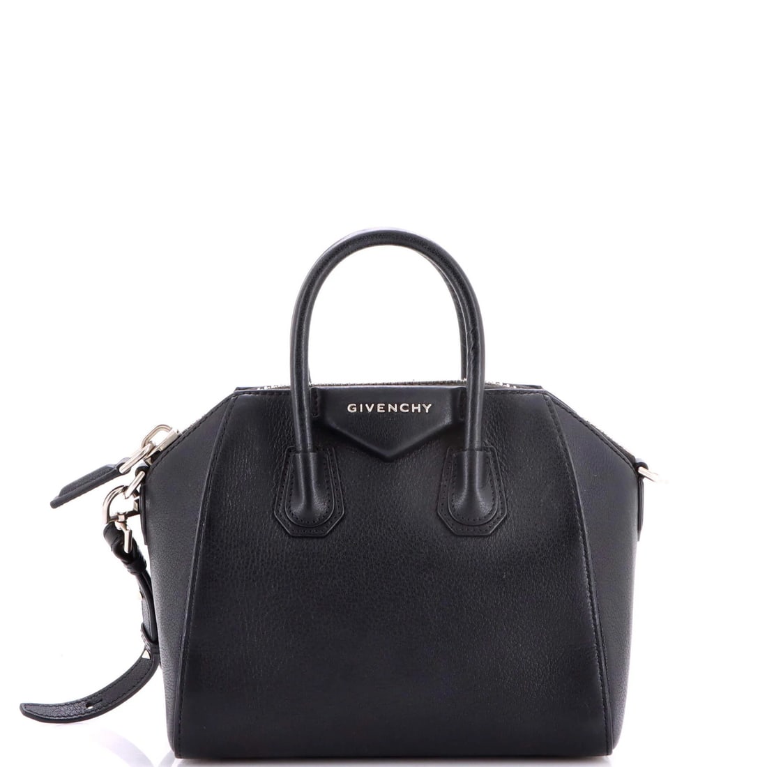 Mini leather bag from Givenchy: Mini leather bag from Givenchy The Givenchy Mini Leather Bag features sleek black leather exterior, silver hardware, and a compact design. With a strap drop of 19-23" and measurements of 3" handle dro