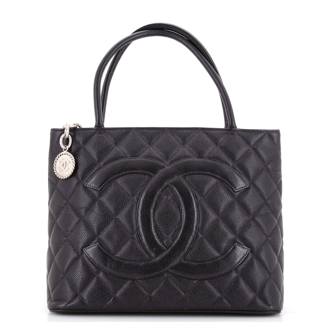 Quilted tote medallion Chanel caviar: Quilted tote medallion Chanel caviar Black quilted caviar medallion tote with leather exterior and interior, featuring silver hardware. The item has some wear on the exterior, including corner wear, c