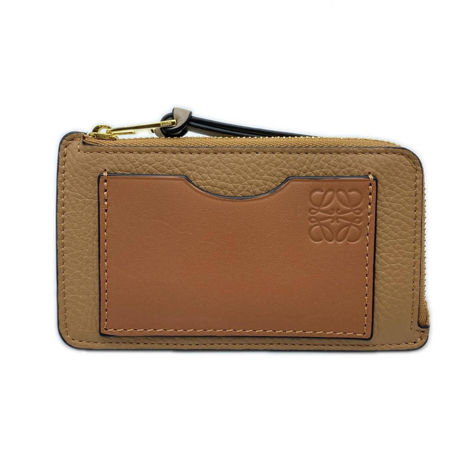 Loewe Coin Purse/ Coin Case Leather: Loewe Coin Purse/ Coin Case Leather This beautiful Loewe coin purse features rich brown calfskin leather and a sturdy zipper closure. With its compact size and elegant design, it's perfect for