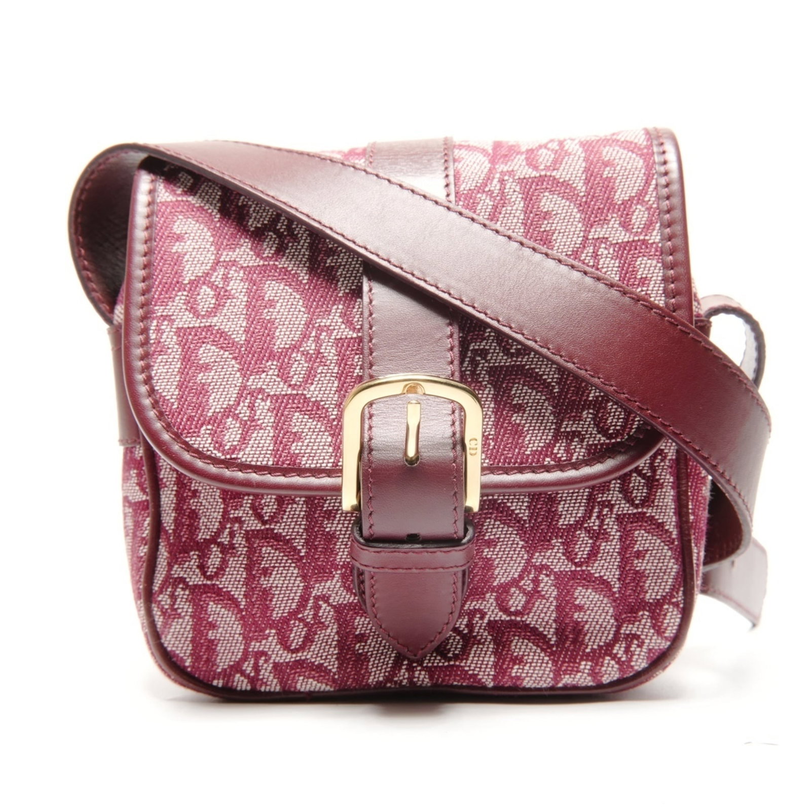 Shoulder Bag By Christian Dior: Shoulder Bag By Christian Dior This vibrant red shoulder bag by Christian Dior features a classic design with clean lines and a timeless silhouette. Made from high-quality canvas, the bag boasts a sty