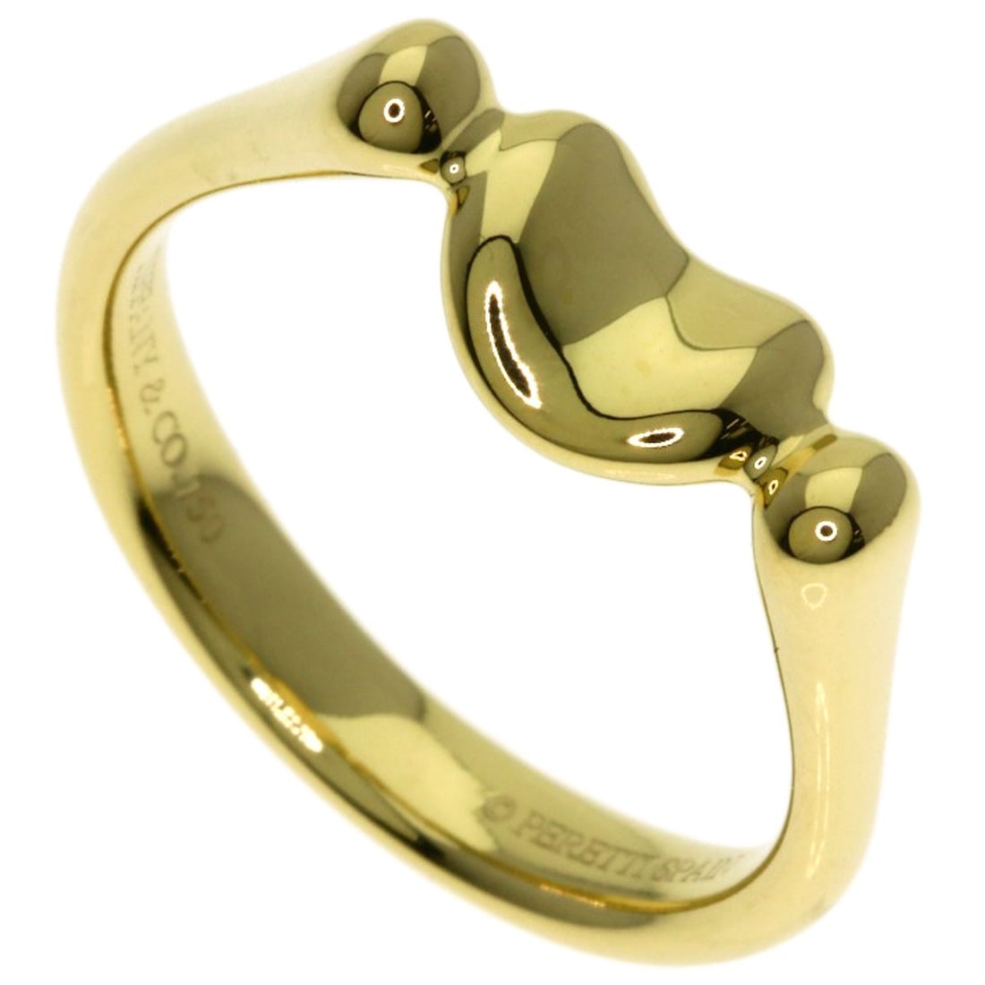 Bean ring gold K18 yellow Tiffany&Co: Bean ring gold K18 yellow Tiffany&Co K18 yellow gold ring from Tiffany&Co. Features a unique bean-shaped design, crafted from high-purity K18 gold. This elegant ring boasts a distinctive style and lux