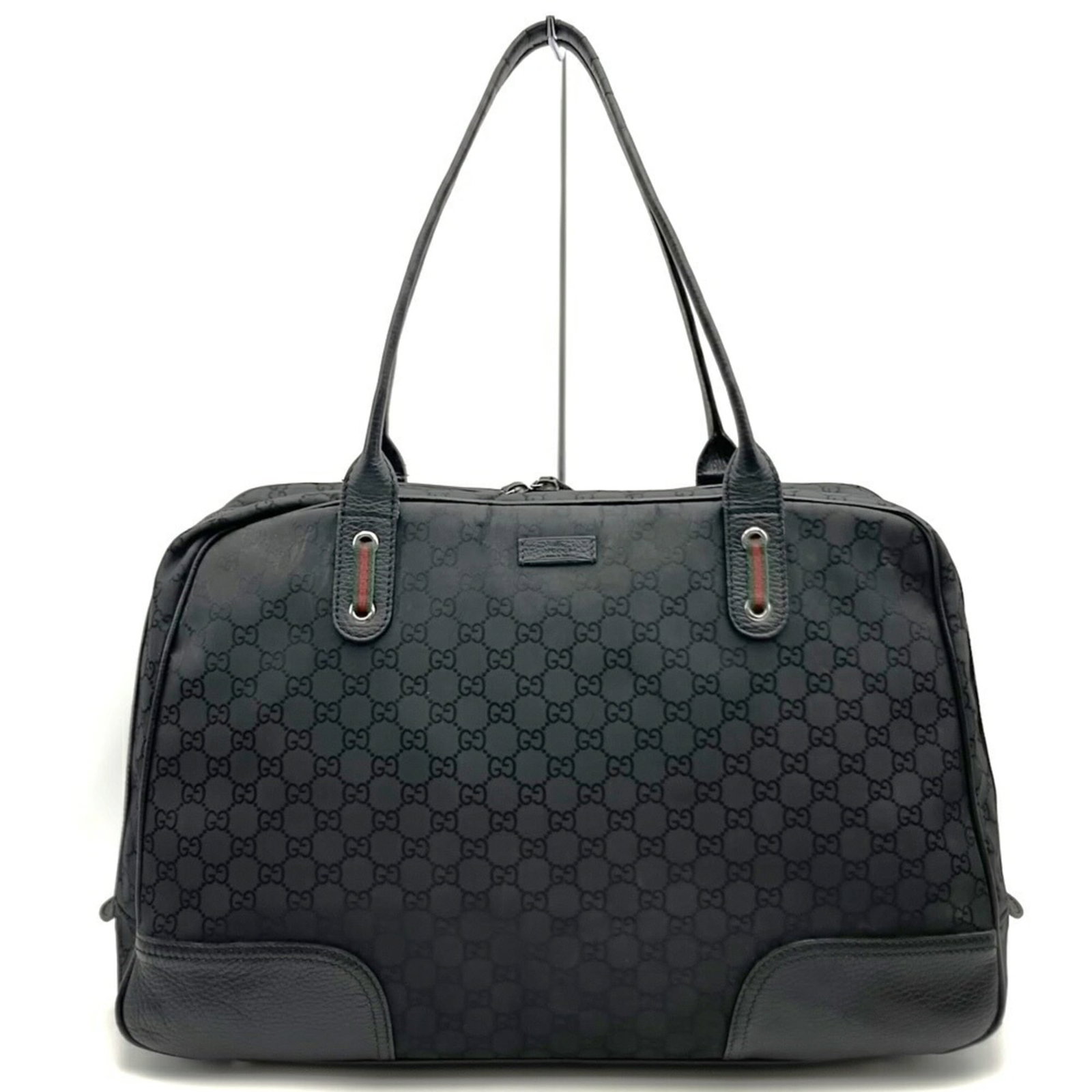 Nylon Leather Tote Gucci Bag Shoulder: Nylon Leather Tote Gucci Bag Shoulder Nylon and leather combine in this sleek Gucci shoulder tote, measuring 27cm x 45cm x 14cm. The black color provides a versatile canvas for everyday use. Its