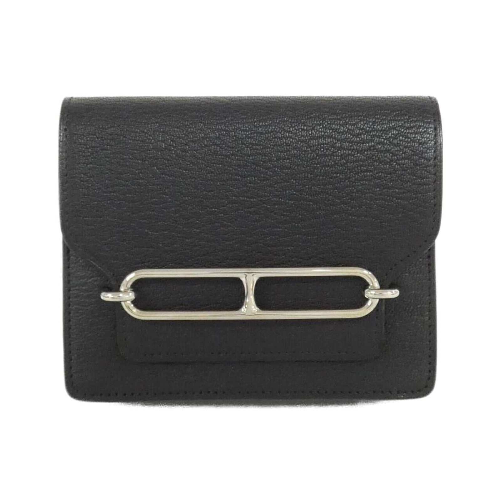 Chevre leather Bi-fold Hermes wallet: Chevre leather Bi-fold Hermes wallet Chevre leather bi-fold wallet from Hermes, featuring a sleek black design and precise measurements at 10.5cm x 12.5cm x 2.5cm. Made with high-quality chevre leathe