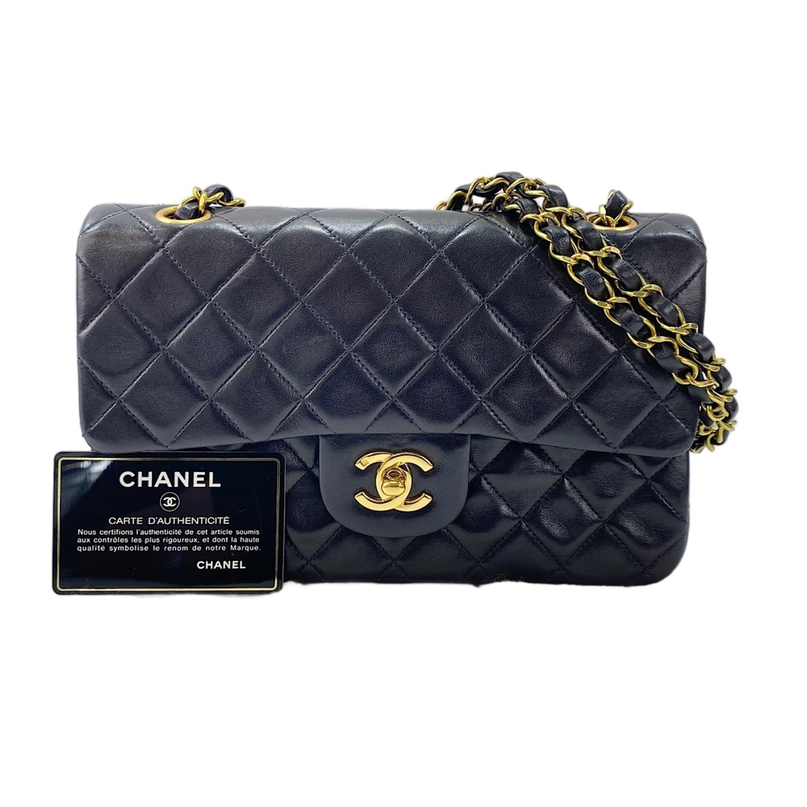 Shoulder Bag by Chanel: Shoulder Bag by Chanel This black Chanel shoulder bag features a sleek design with dimensions of 14cm x 23cm x 6.5cm, making it a stylish and compact accessory for everyday use. The bag's classic styl