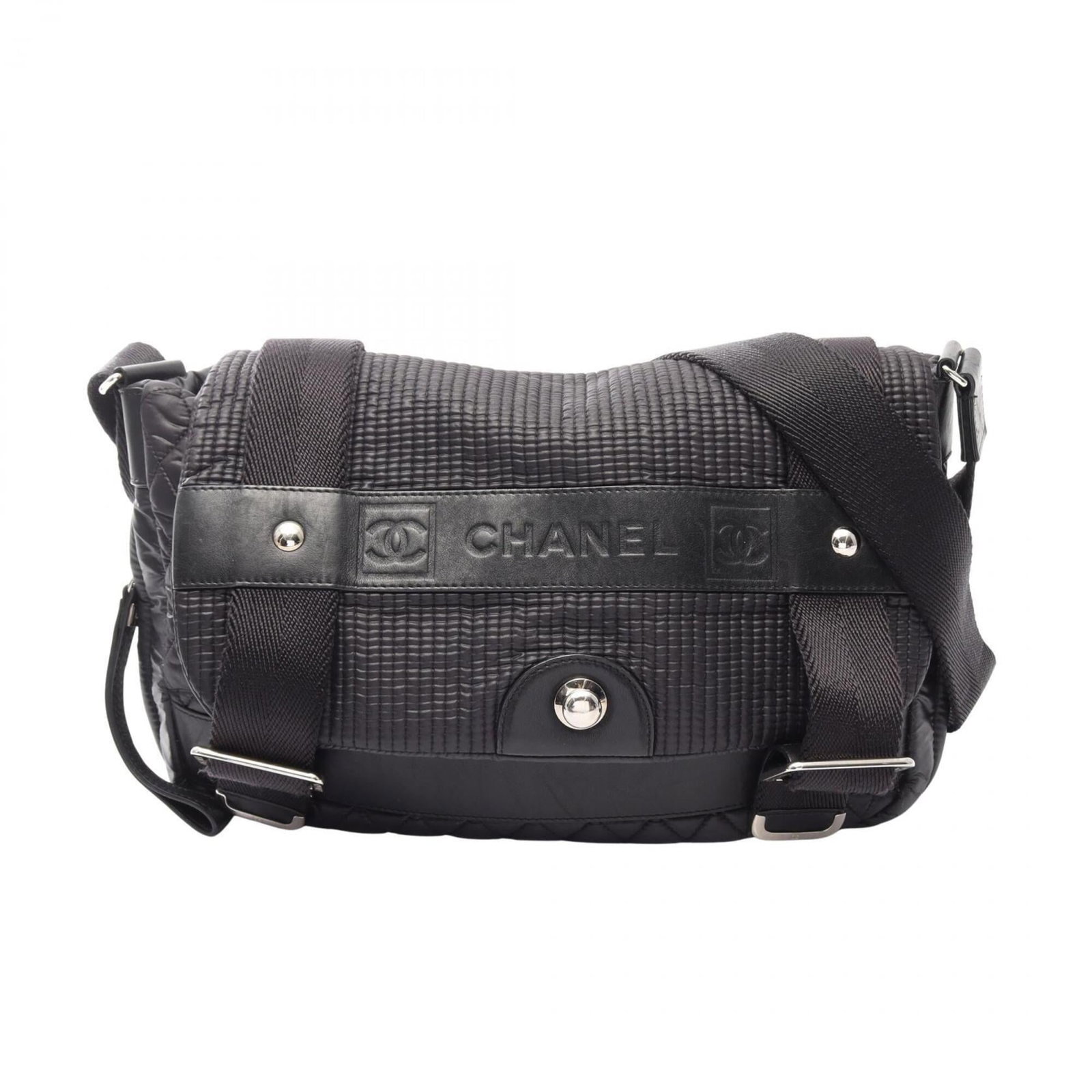 Handbag Nylon Leather Shoulder Bag by Chanel: Handbag Nylon Leather Shoulder Bag by Chanel Nylon and leather combine in sleek, modern design. This black Chanel shoulder bag features silver hardware for a touch of sophistication. Its compact size 
