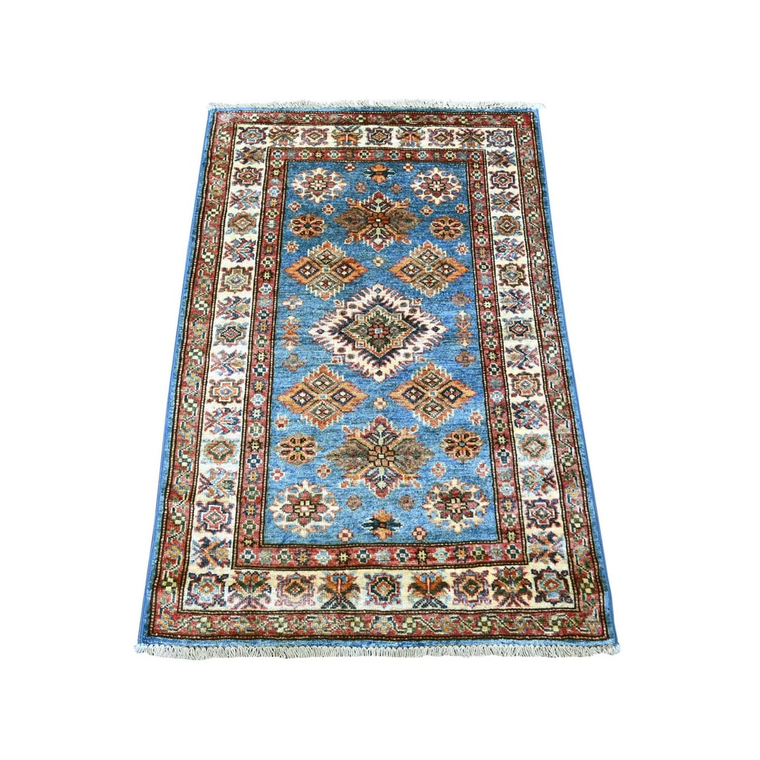 2'9"x4'1" Blue Afghan Super Kazak Hand Knotted Pure Wool Sample Mat Rug: 2'9"x4'1" Blue Afghan Super Kazak Hand Knotted Pure Wool Sample Mat Rug Hand-knotted in pure wool, this stunning Blue Afghan Super Kazak rug boasts an all-over regional design in shades of blue, navy,