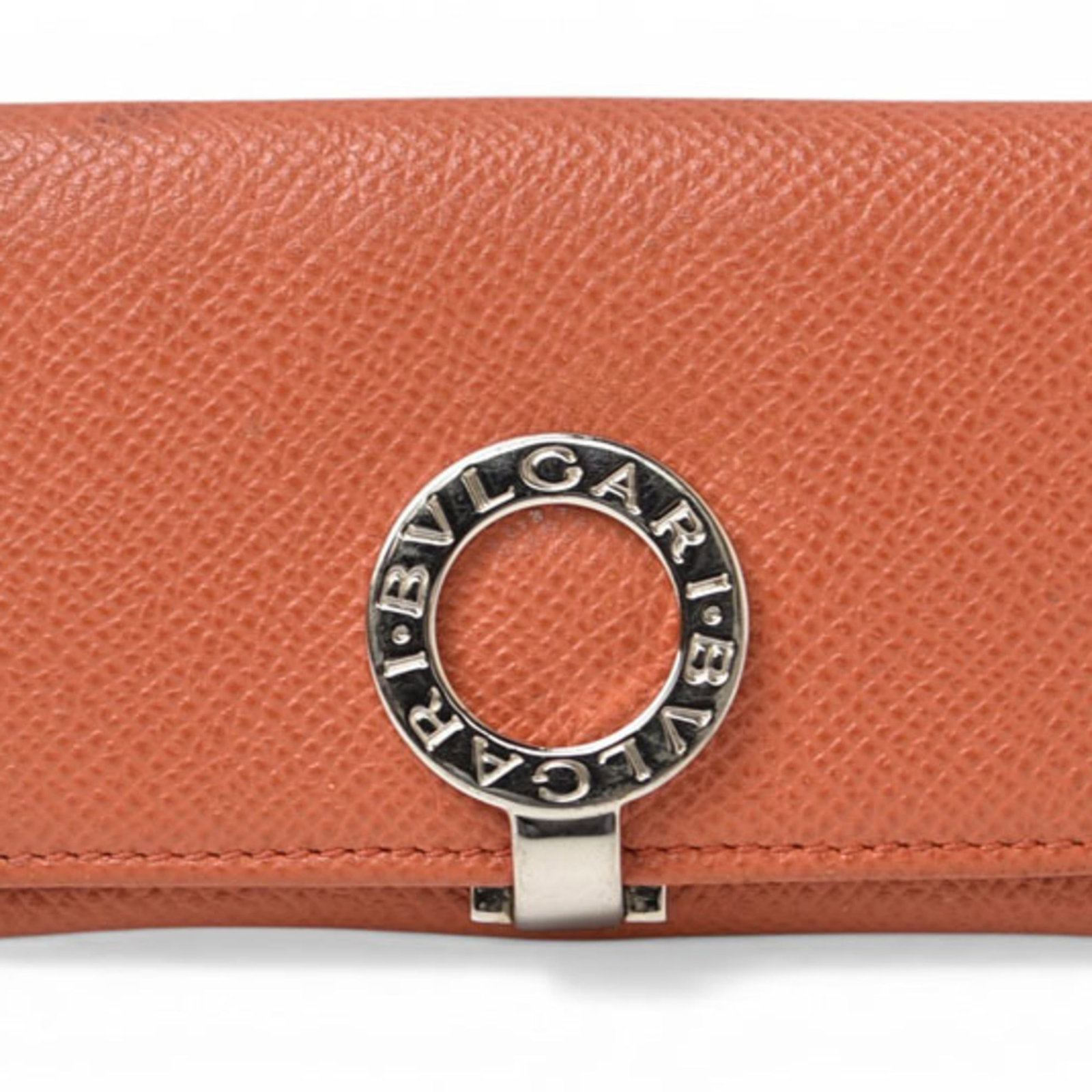 Bvlgari Coin Purse/ Coin Case Leather: Bvlgari Coin Purse/ Coin Case Leather Bvlgari's iconic coin purse/coin case features a vibrant orange leather exterior, showcasing the brand's signature style. Measuring 6.3cm x 10.2cm x 1cm, this com
