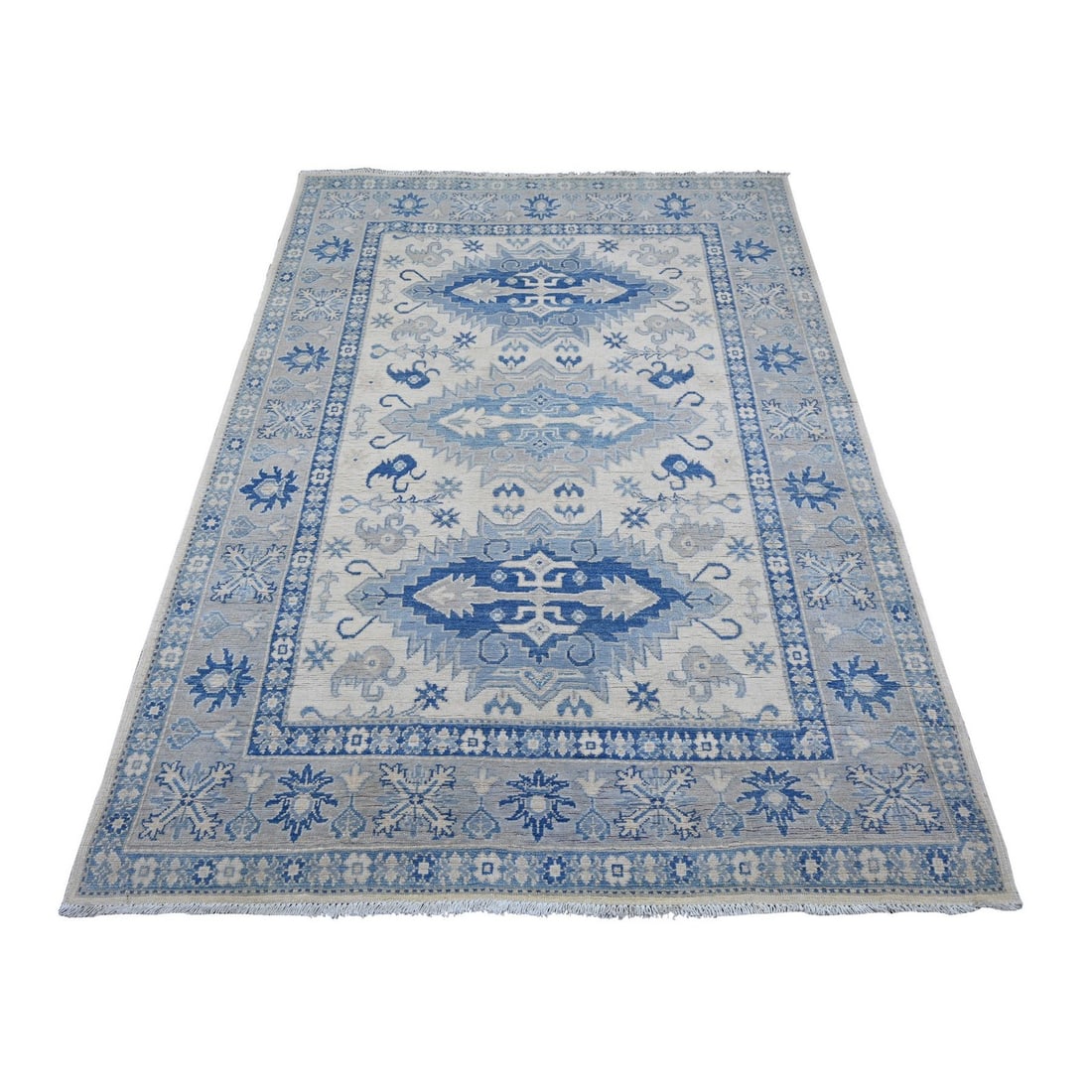 4'10"x6'9" Ivory Vintage Look Kazak Floral Elements Wool Hand Knotted Rug: 4'10"x6'9" Ivory Vintage Look Kazak Floral Elements Wool Hand Knotted Rug The Kazak-style floral elements wool hand-knotted rug boasts an elegant ivory color with intricate geometric patterns, reminis