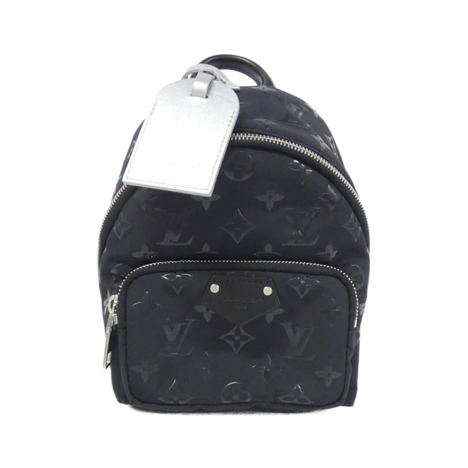 Canvas nylon backpack by Louis Vuitton: Canvas nylon backpack by Louis Vuitton Canvas nylon backpack by Louis Vuitton, featuring black nylon canvas construction and a compact size. Includes dust bag and name tag for added convenience. A