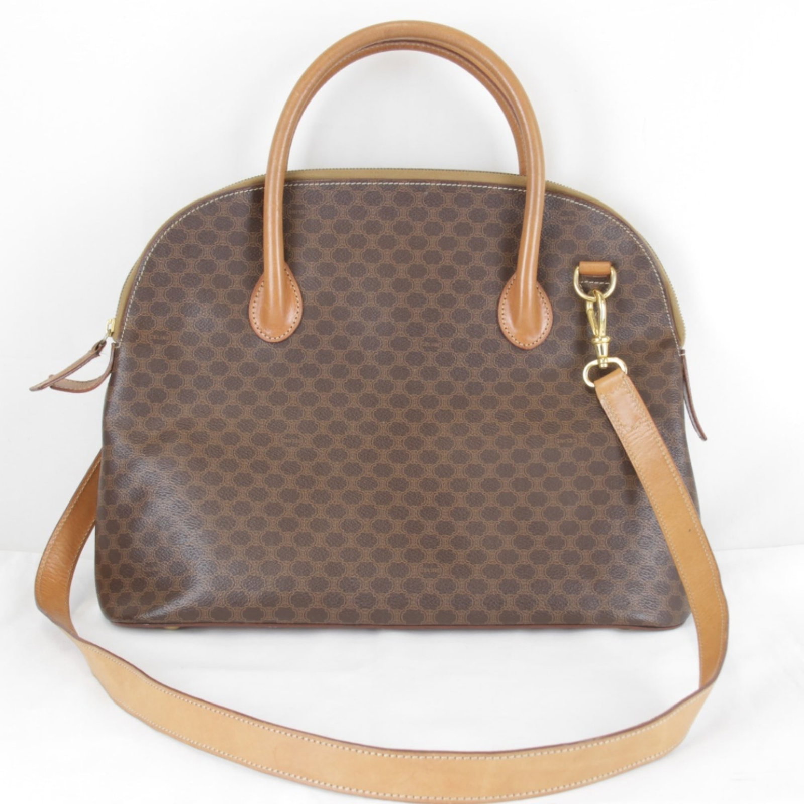 PVC Leather Shoulder Bag By Celine: PVC Leather Shoulder Bag By Celine PVC Leather Shoulder Bag By Celine - A stylish and modern accessory, this shoulder bag features a unique blend of PVC and leather materials in a rich brown color. Me