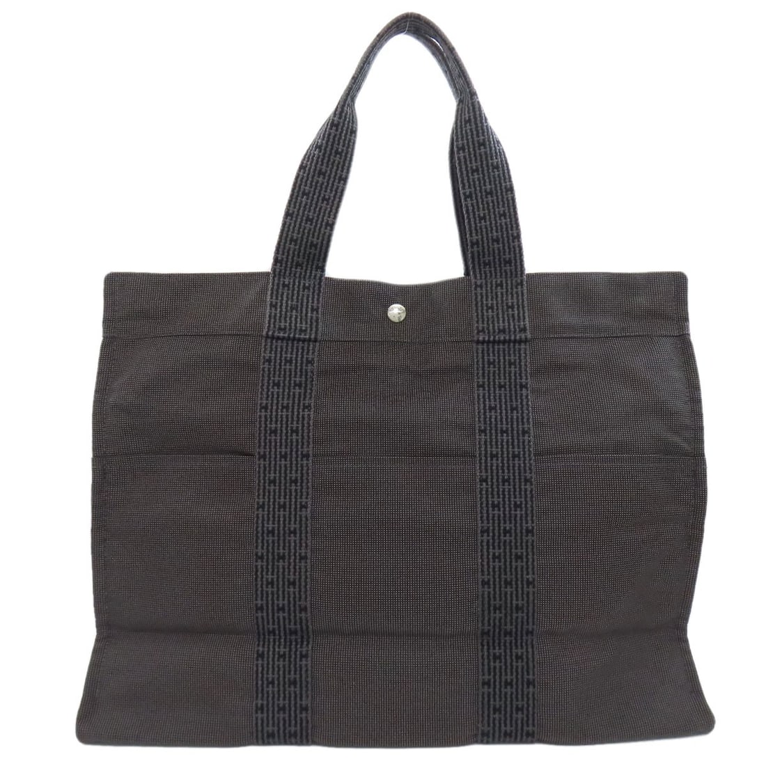 Hermes Her Linegm Tote Bag Canvas: Hermes Her Linegm Tote Bag Canvas Gray canvas tote bag from HERMES' Her Linegm collection, featuring a classic design with a timeless gray exterior. This versatile and stylish bag is made from high-qu