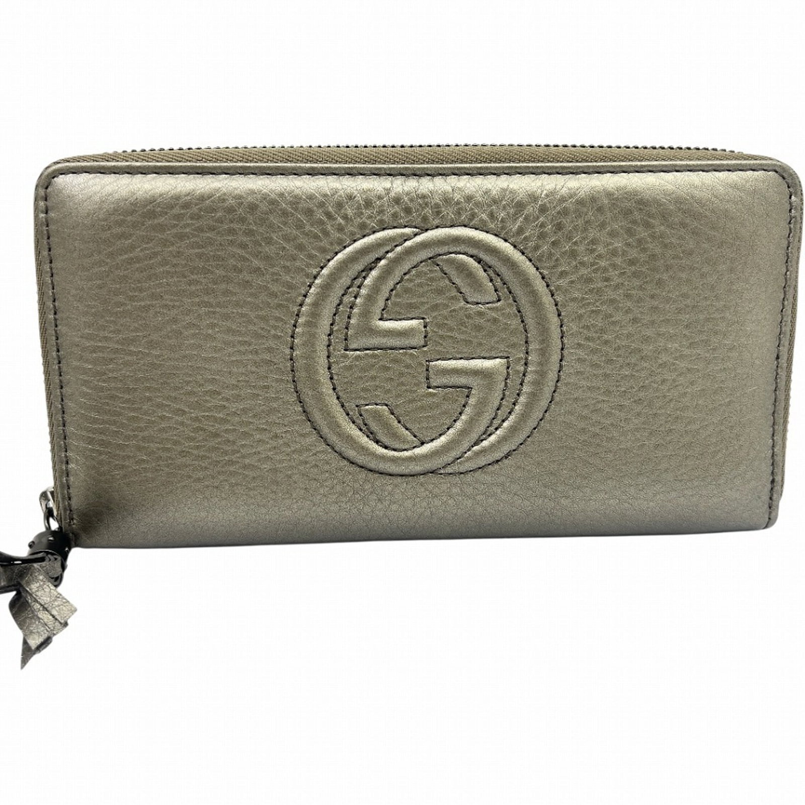 Leather Bi Fold Wallet Gucci: Leather Bi Fold Wallet Gucci Gucci's Leather Bi Fold Wallet boasts a sleek metallic gold finish, measuring 10.5cm x 19cm x 2.5cm. This long wallet features high-quality leather construction and comes 