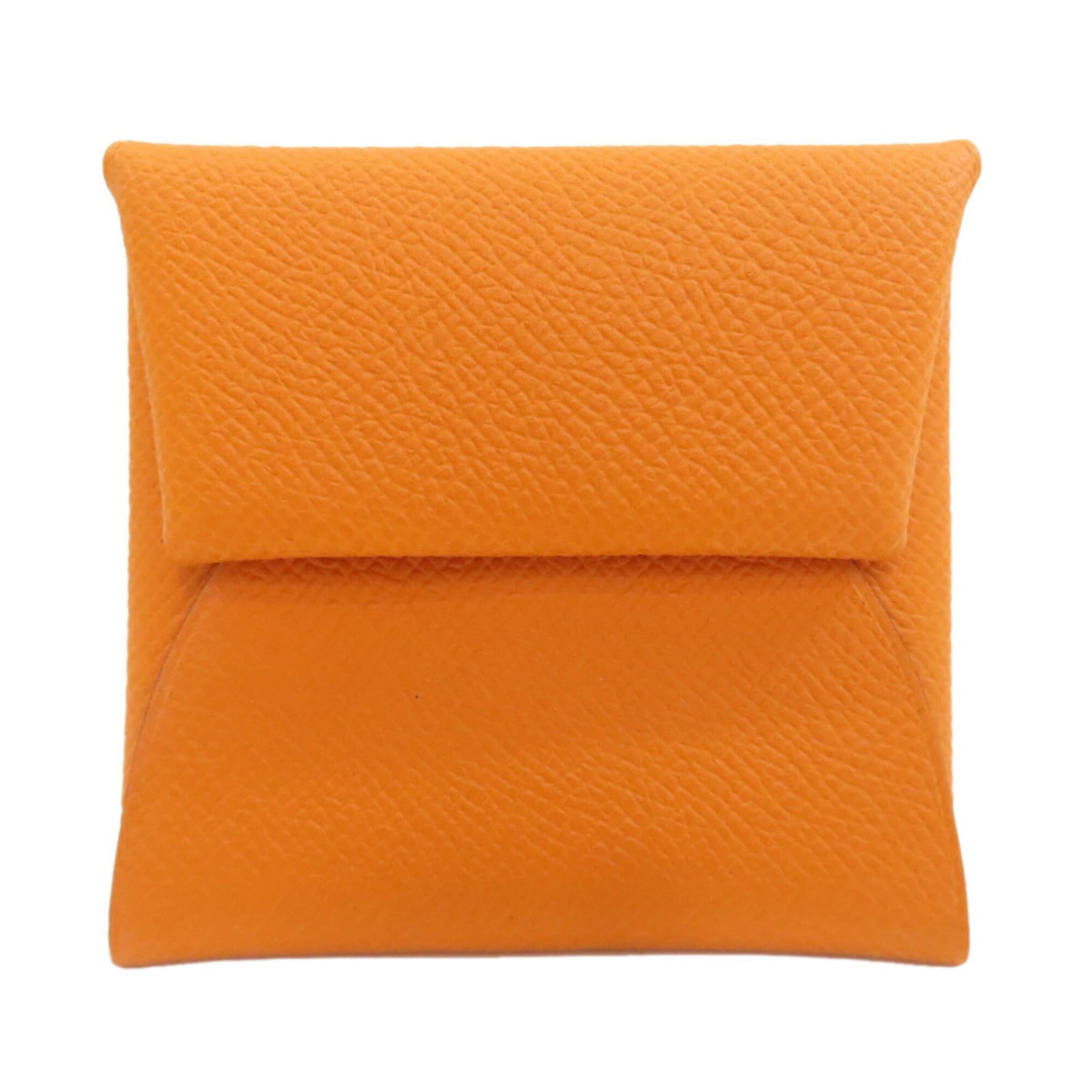 Hermes Coin Purse/ Coin Case Epsom Leather: Hermes Coin Purse/ Coin Case Epsom Leather Epsom leather craftsmanship shines in this vibrant orange coin purse/coin case from Hermes, boasting a compact size and sleek design. Made with high-quality 