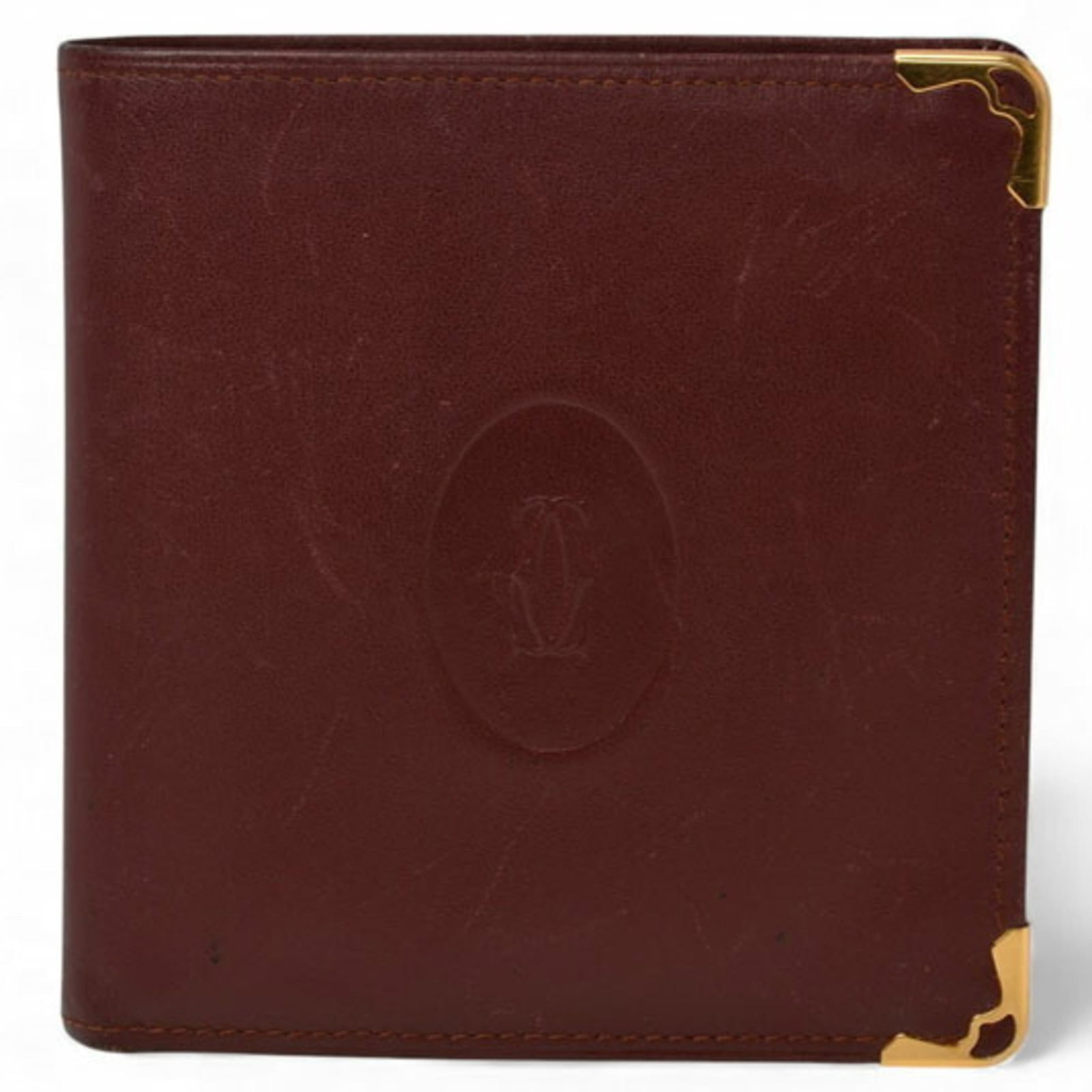 Cartier Wallet (Bi-Fold) Leather: Cartier Wallet (Bi-Fold) Leather Cartier's bi-fold leather wallet boasts classic design with clean lines and elegant proportions. Made from high-quality Italian leather, its Bordeaux color adds a touc