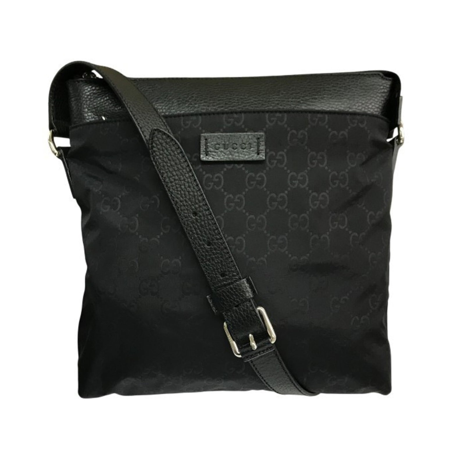 Nylon leather bag from Gucci: Nylon leather bag from Gucci Nylon leather bag from Gucci, made with a combination of nylon and leather materials, features a sleek black design. The bag measures 26cm x 25cm x 5cm in size, making it 