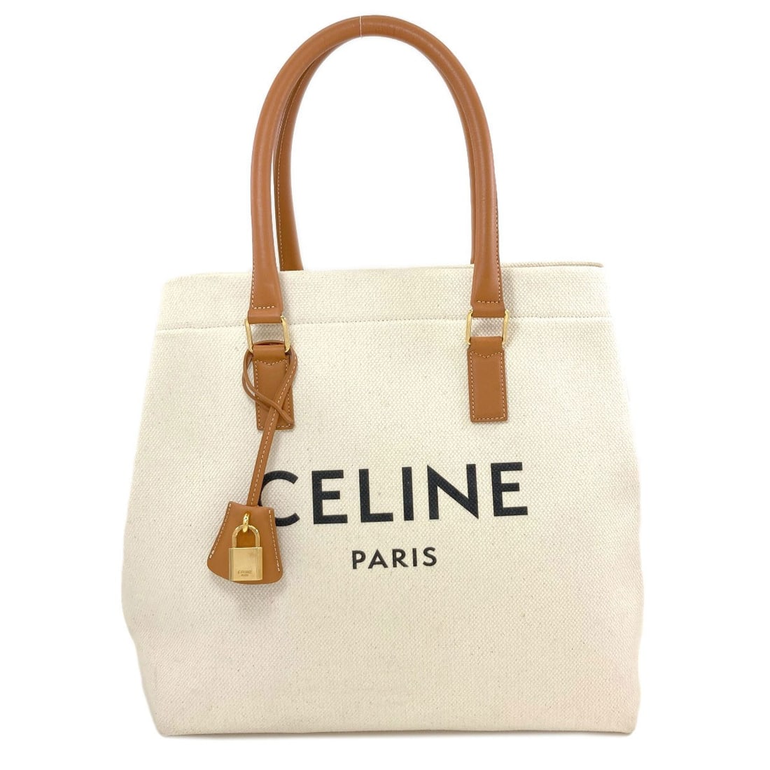 Cabas Canvas Handbag Horizontal Celine: Cabas Canvas Handbag Horizontal Celine White canvas handbag with a clean, modern design from CELINE. The simple yet elegant style features a classic horizontal shape, making it a versatile accessory f