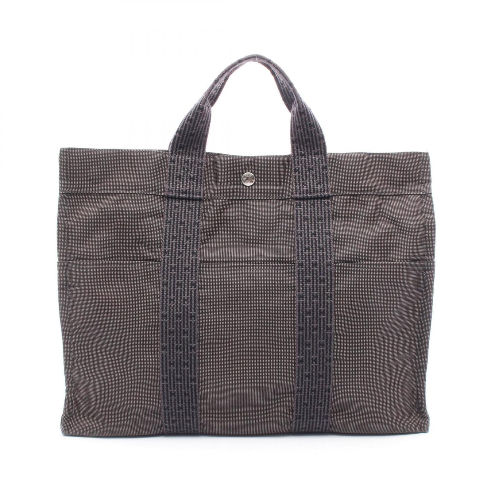 Hermes tote bag nylon canvas: Hermes tote bag nylon canvas Nylon canvas construction provides durability and versatility to this classic Hermes tote bag, available in a timeless gray color. Measuring 32cm x 42cm x 11cm, it feature