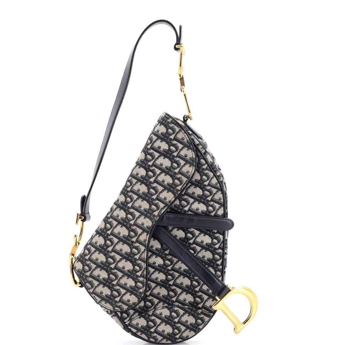 Canvas handbag saddle oblique medium Christian Dior: Canvas handbag saddle oblique medium Christian Dior Canvas handbag saddle oblique medium Christian Dior features a striking blue canvas exterior with minor creases and discoloration. The interior boas