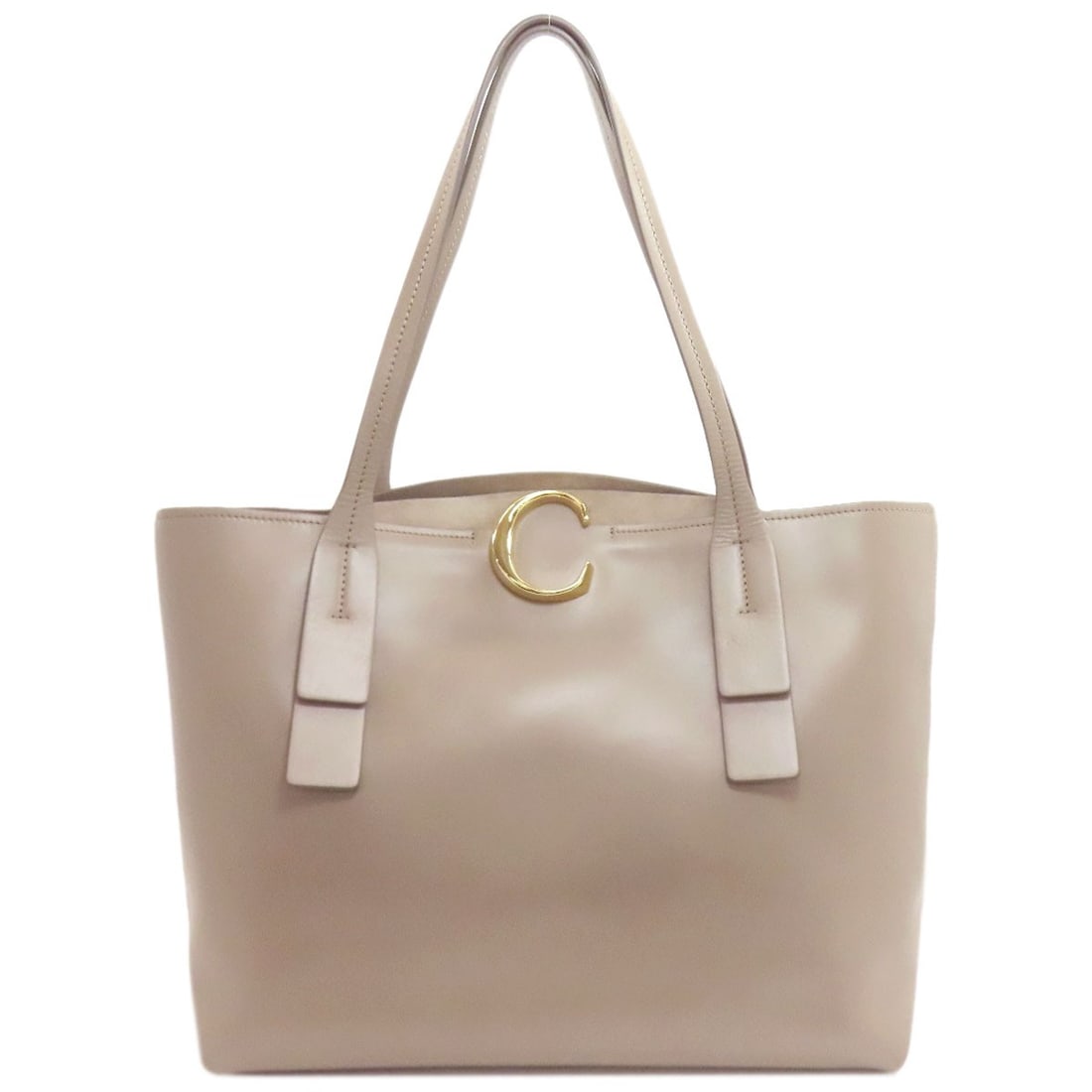 Leather Tote Bag Chloe C Logo: Leather Tote Bag Chloe C Logo Gray leather tote bag with the iconic CHLOE C logo. Made from high-quality leather, this stylish tote features a classic design that's perfect for everyday use. The timel