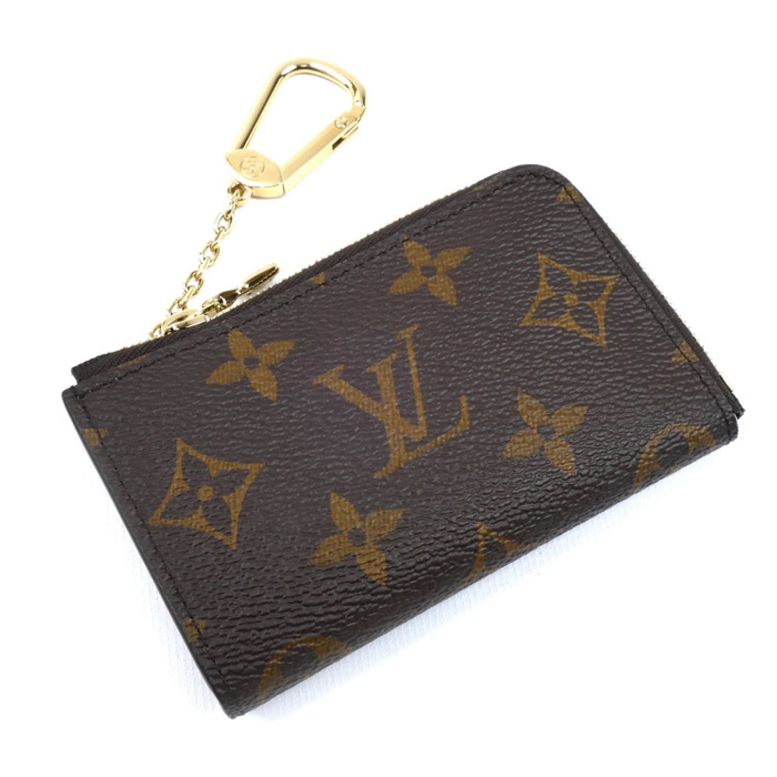 Louis Vuitton Coin Purse/ Coin Case Monogram: Louis Vuitton Coin Purse/ Coin Case Monogram Monogrammed with iconic Louis Vuitton style, this brown coin purse features the signature monogram pattern. Made from high-quality materials, its compact s