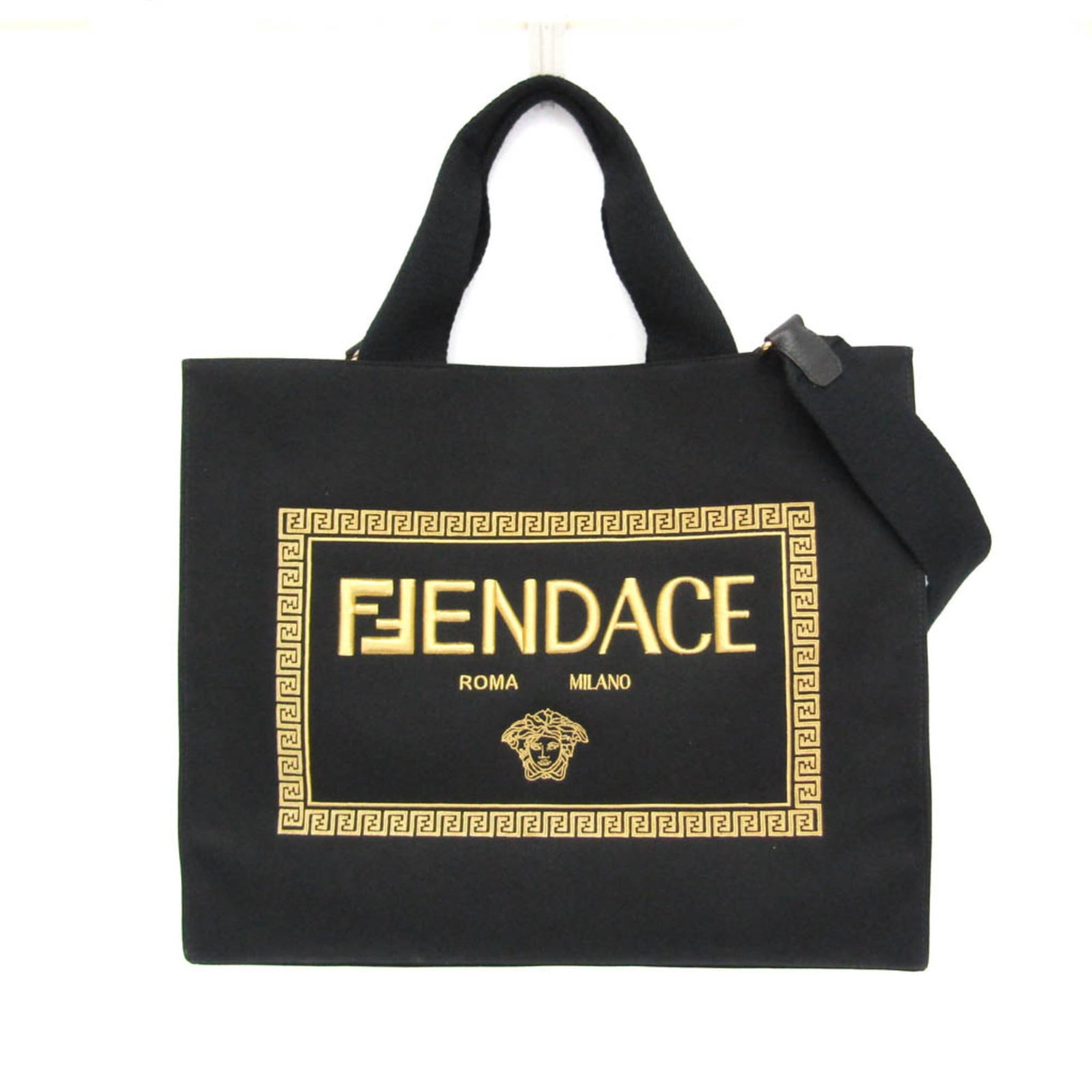 Shoulder Bag Canvas Tote By Fendi: Shoulder Bag Canvas Tote By Fendi Canvas tote bag by Fendi, featuring open design with gold accents and an inner zipper pocket. Made from high-quality canvas material in black color, this shoulder bag