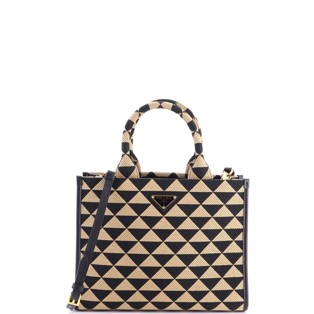 Small Shopper Symbole Prada Tote Jacquard: Small Shopper Symbole Prada Tote Jacquard Small Shopper Symbole Prada Tote Jacquard in Brown, featuring canvas exterior and leather interior. The tote boasts a classic design with minor creases on the
