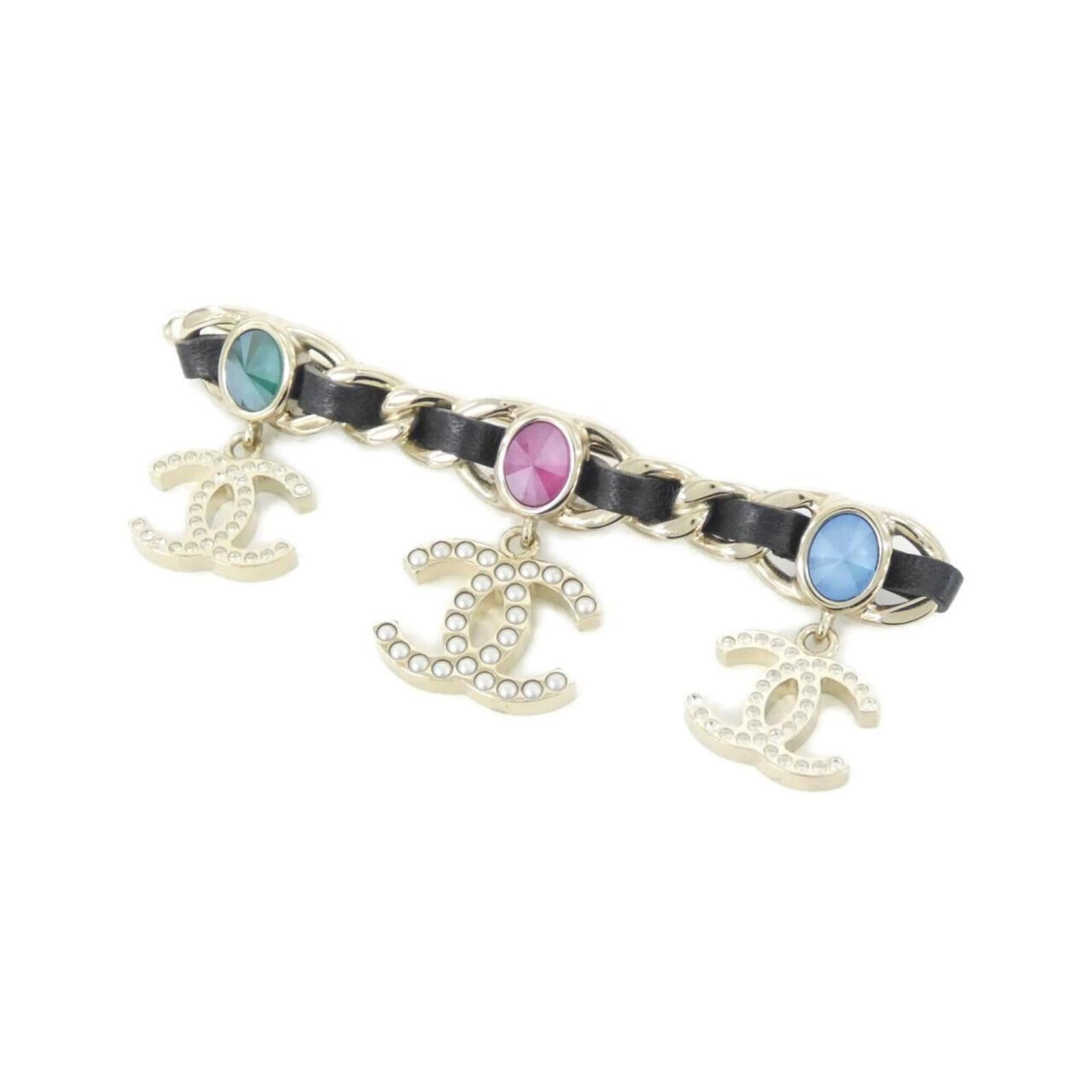 Leather Barrette By: Leather Barrette By Lamb leather barrette from Chanel, featuring a sleek black design with gold accents. The compact size and stylish color make it a versatile accessory for everyday wear. Measuring 3